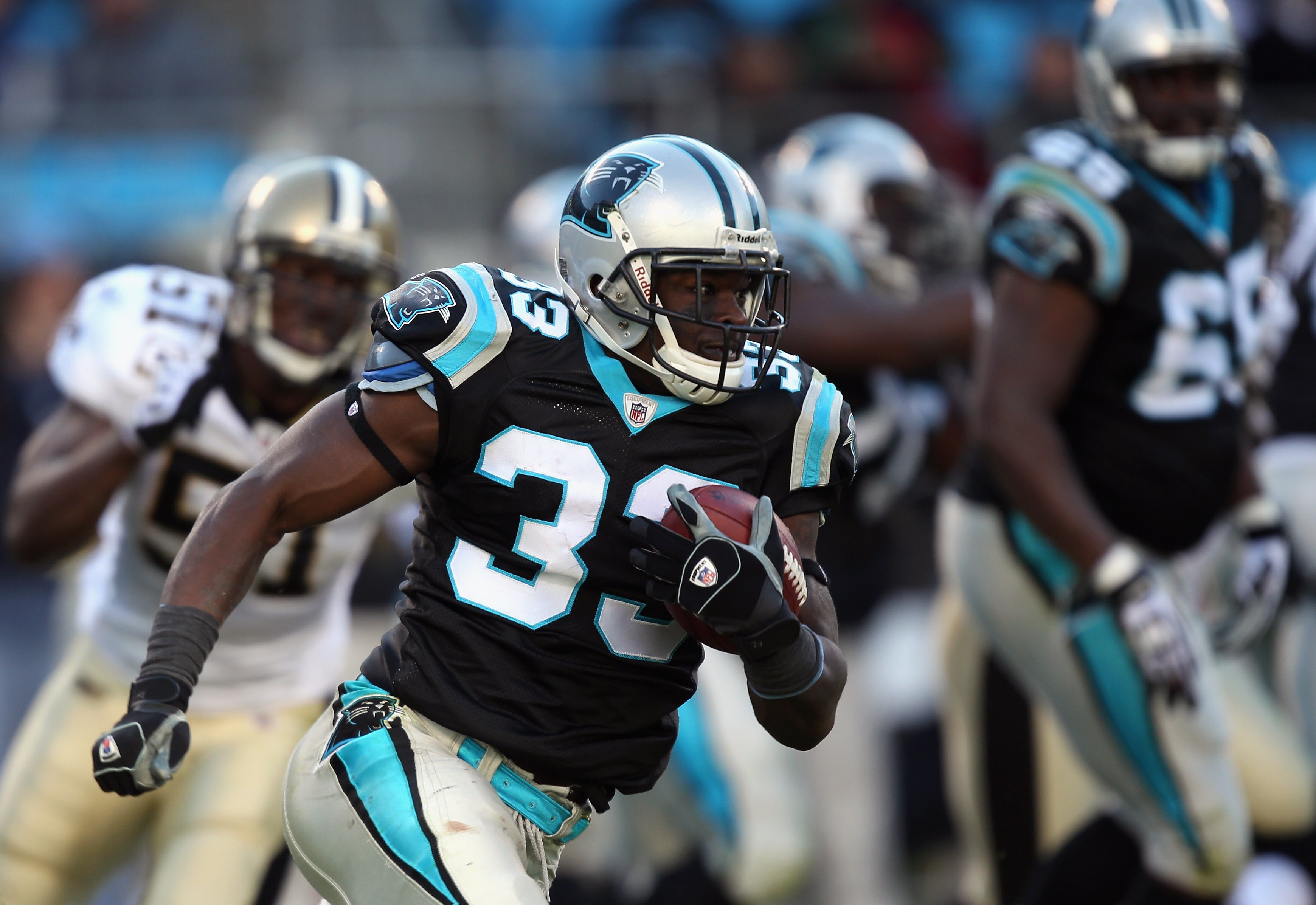 CHARLOTTE, NC - NOVEMBER 07:  Mike Goodson #33 of the Carolina Panthers runs with the ball against the New Orleans Saints during their game at Bank of America Stadium on November 7, 2010 in Charlotte, North Carolina.  (Photo by Streeter Lecka/Getty Images