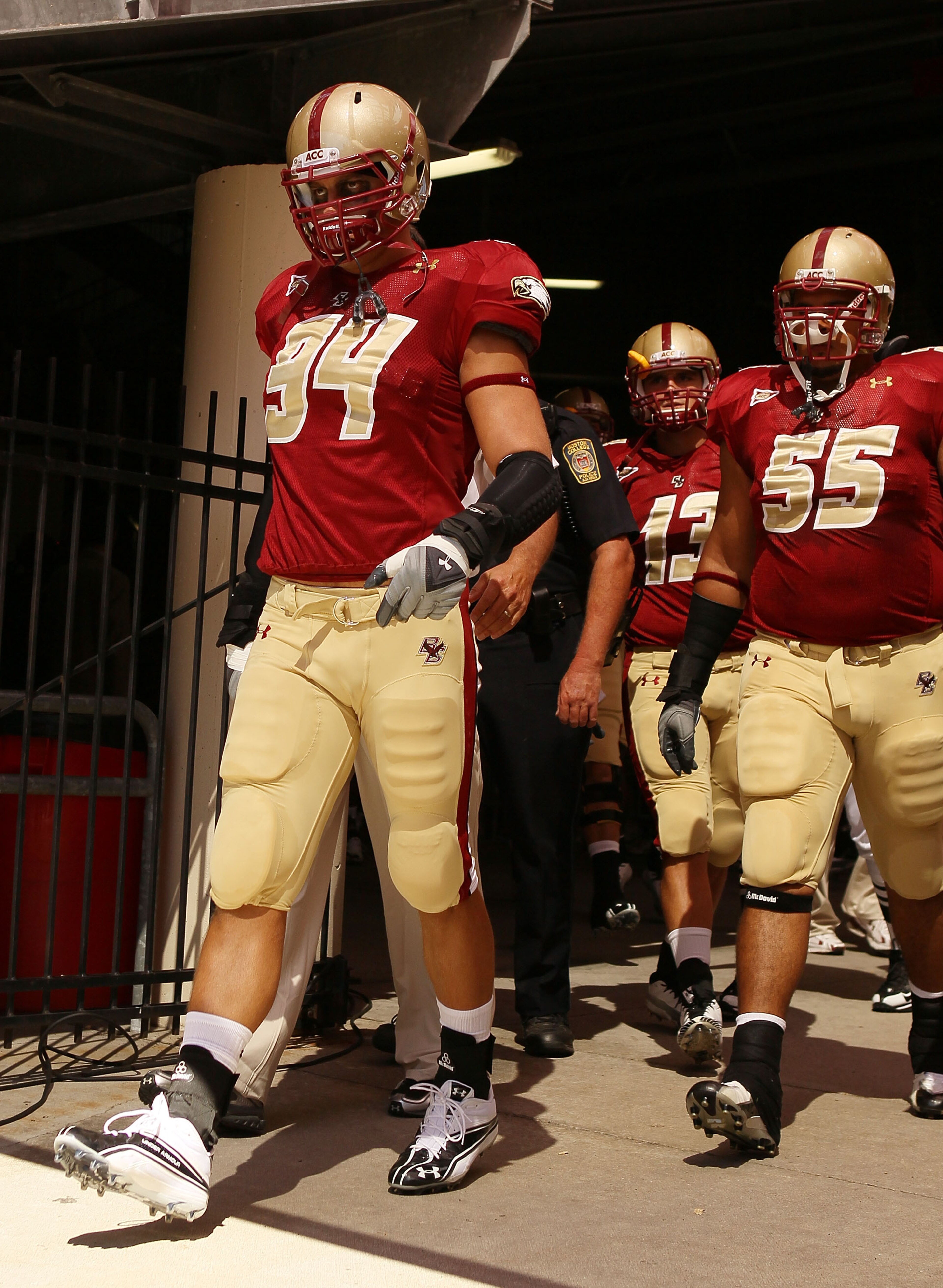CHESTNUT HILL, MA - SEPTEMBER 04:  Mark Herzlich #94, Damik Scafe #55 and Codi Boek #13 of the Boston College Eagles walk out to the field for the home opening game against the Weber State Wildcats on September 4, 2010 at Alumni Stadium in Chestnut Hill,
