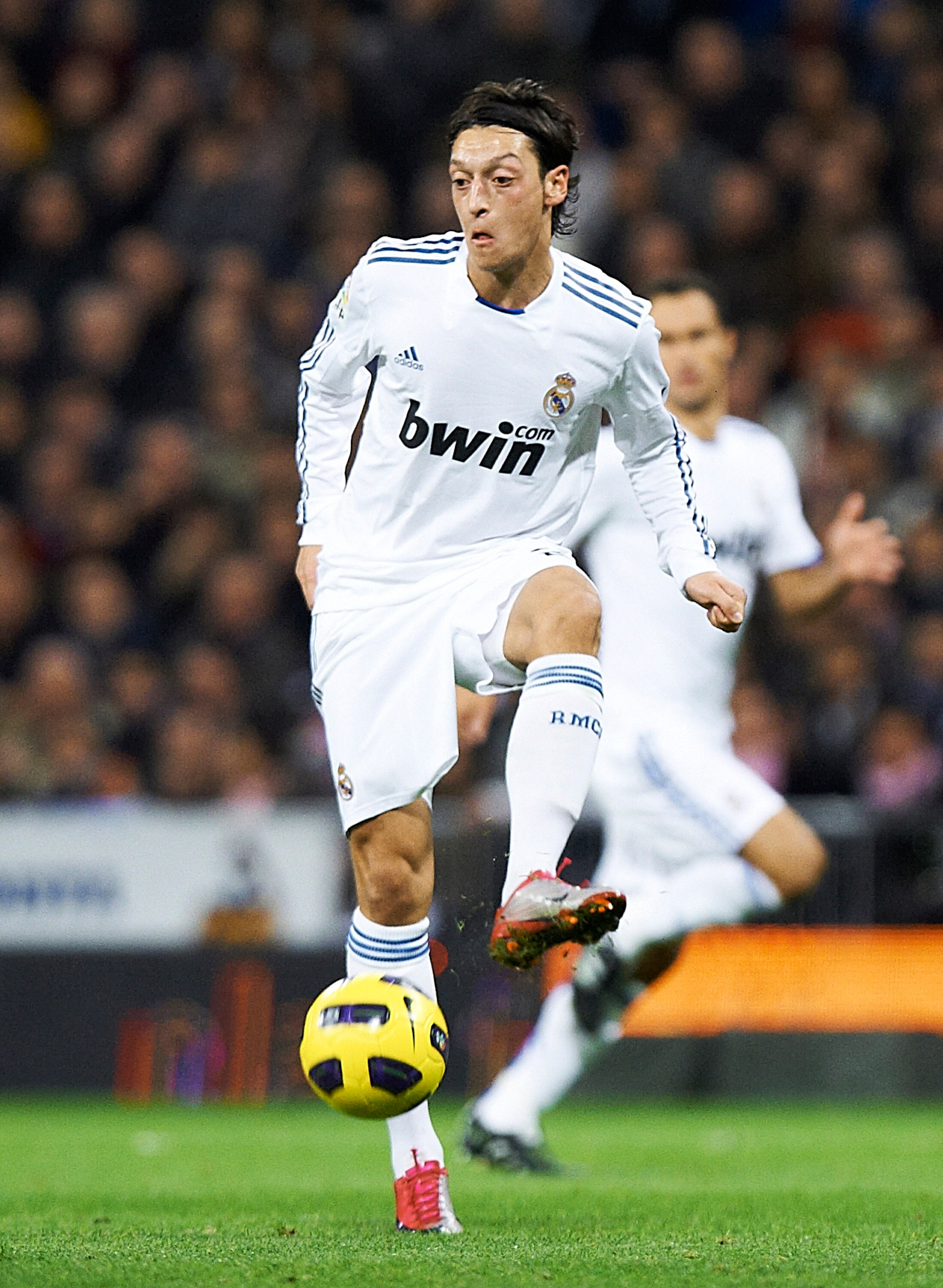 MADRID, SPAIN - NOVEMBER 20:  Mesut Ozil of Real Madrid controls the ball during the la liga match between Real Madrid and Athletic Bilbao at Estadio Santiago Bernabeu on November 20, 2010 in Madrid, Spain. Real Madrid won 5-1.  (Photo by Manuel Queimadel