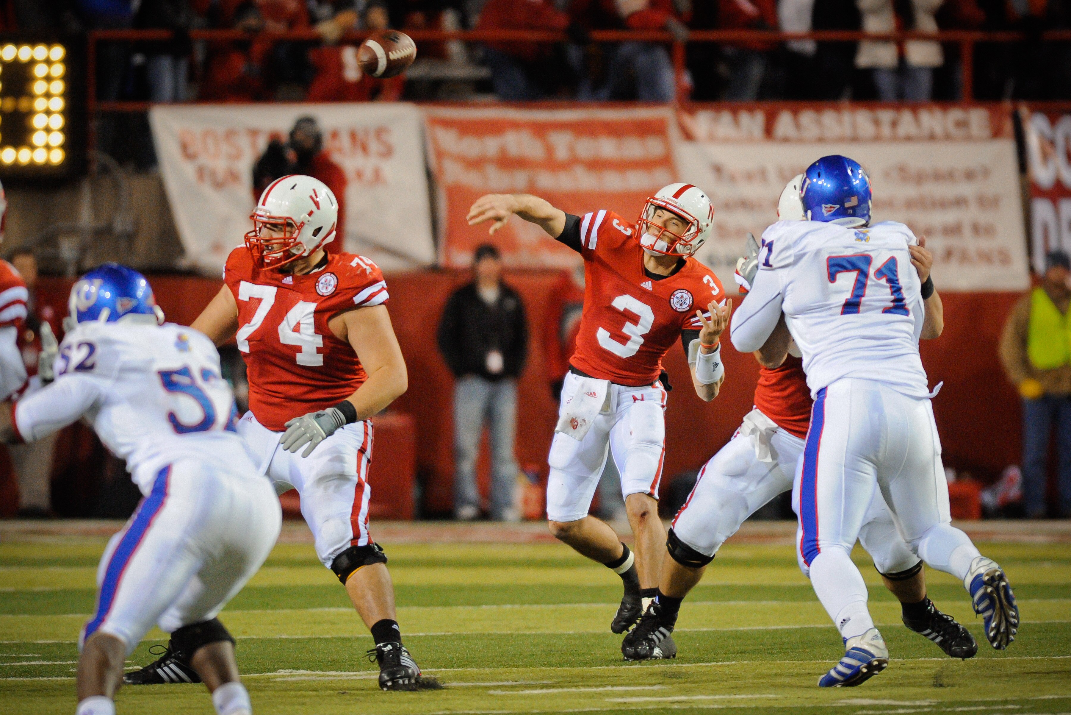 LINCOLN, NE - NOVEMBER 13: Taylor Martinez #3 of the Nebraska Cornhuskers throws the ball downfield against the Kansas Jawhawks during second half action of their game at Memorial Stadium on November 13, 2010 in Lincoln, Nebraska. Nebraska Defeated Kansas