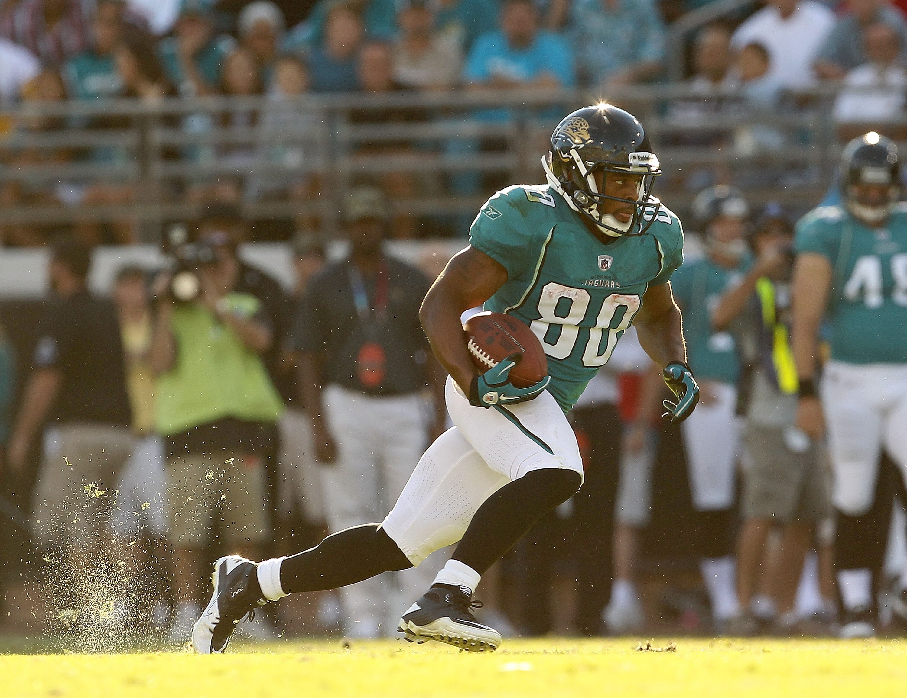 JACKSONVILLE, FL - NOVEMBER 14:  Mike Thomas #80 of the Jacksonville Jaguars runs after a catch during a game against the Houston Texans at EverBank Field on November 14, 2010 in Jacksonville, Florida.  (Photo by Mike Ehrmann/Getty Images)