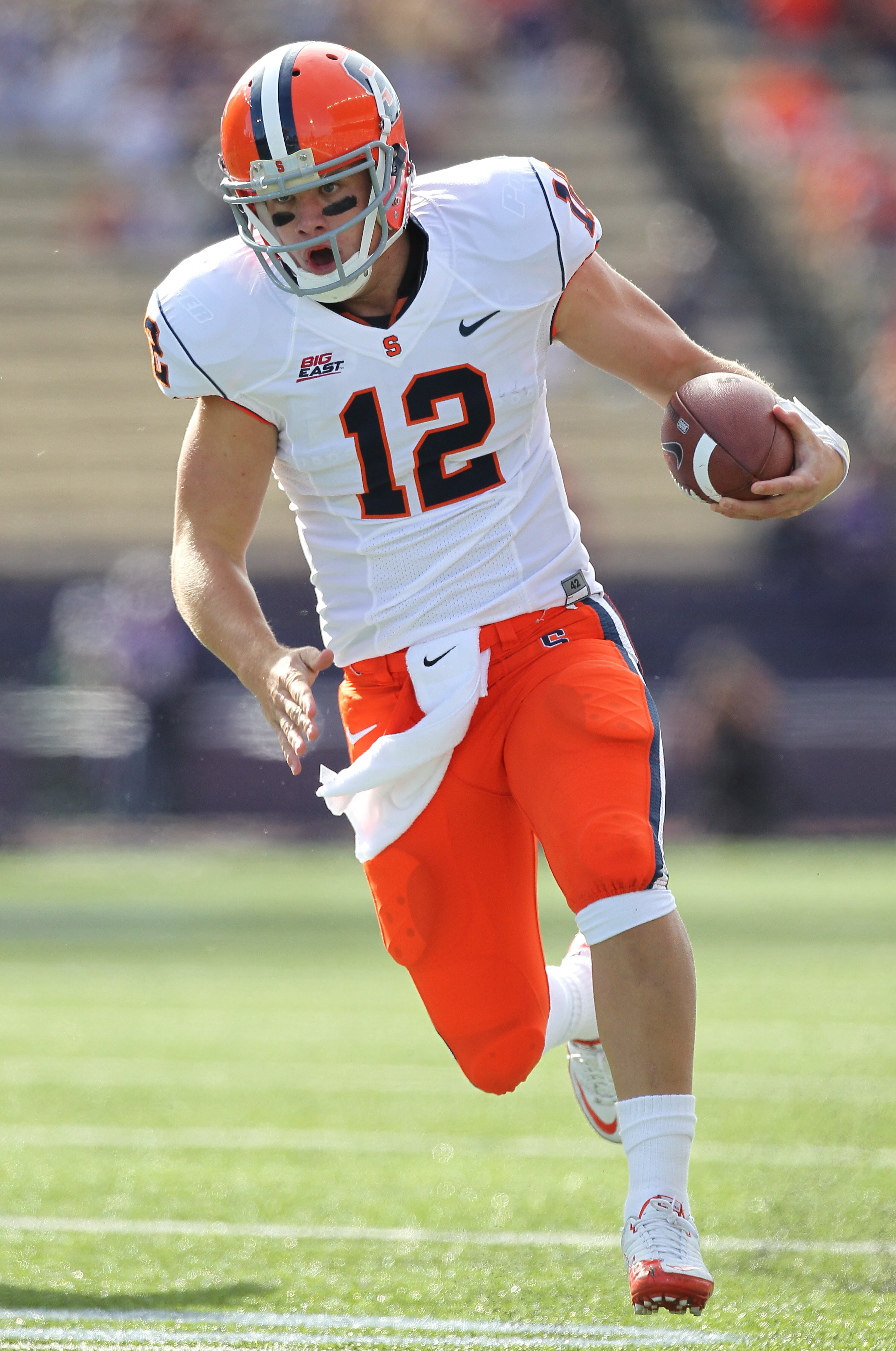 SEATTLE - SEPTEMBER 11:  Quarterback Ryan Nassib #12 of the Syracuse Orange rushes for a touchdown in the first quarter against the Washington Huskies on September 11, 2010 at Husky Stadium in Seattle, Washington. (Photo by Otto Greule Jr/Getty Images)