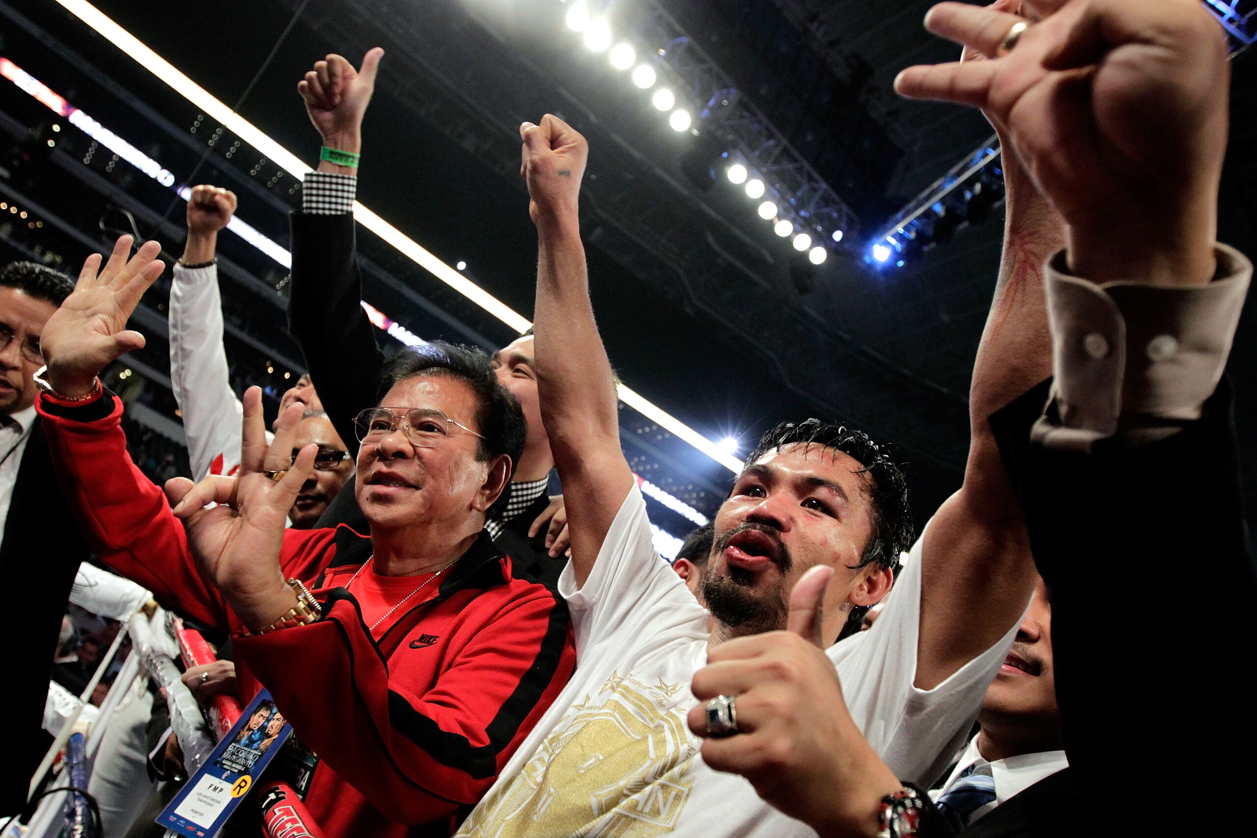 ARLINGTON, TX - NOVEMBER 13: Manny Pacquiao (white trunks) of the Philippines celebrates after he was declared the winner by a unanimous decision against Antonio Margarito (black trunks) of Mexico during their WBC World Super Welterweight Title bout at C ARLINGTON, TX - NOVEMBER 13: Manny Pacquiao (white trunks) of the Philippines celebrates after he was declared the winner by a unanimous decision against Antonio Margarito (black trunks) of Mexico during their WBC World Super Welterweight Title bout at C