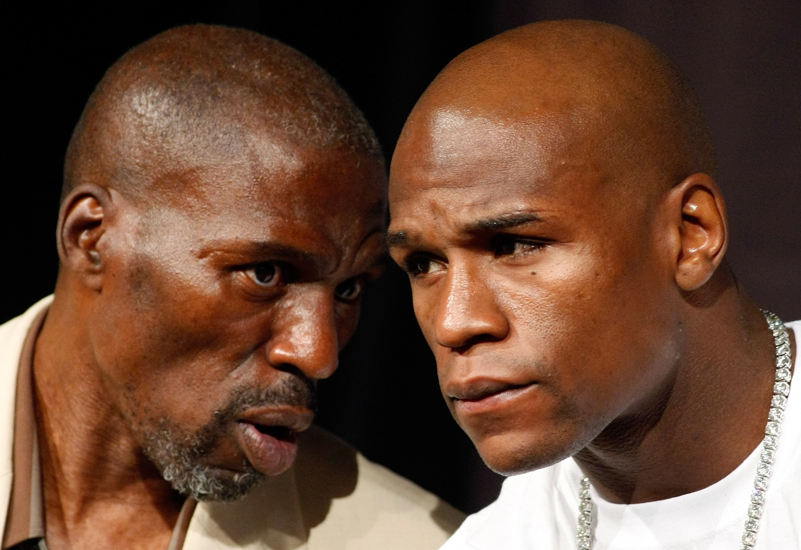 LAS VEGAS - SEPTEMBER 16: Boxer Floyd Mayweather Jr. (R) and his uncle and trainer Roger Mayweather confer during the final news conference for their bout against Juan Manuel Marquez at the MGM Grand Hotel/Casino September 16, 2009 in Las Vegas, Nevada. LAS VEGAS - SEPTEMBER 16: Boxer Floyd Mayweather Jr. (R) and his uncle and trainer Roger Mayweather confer during the final news conference for their bout against Juan Manuel Marquez at the MGM Grand Hotel/Casino September 16, 2009 in Las Vegas, Nevada.