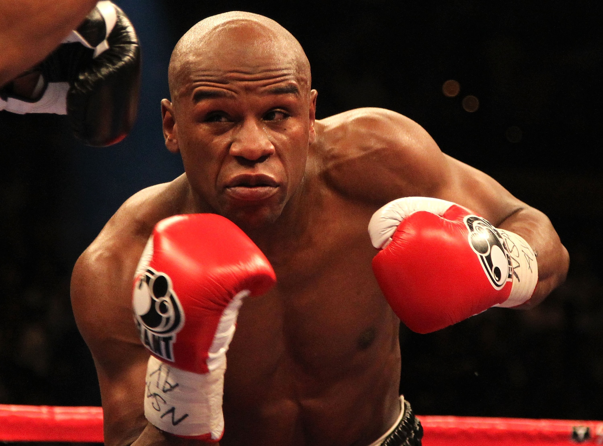 LAS VEGAS - MAY 01: (R-L) Floyd Mayweather Jr. in action against Shane Mosley during their welterweight fight at the MGM Grand Garden Arena on May 1, 2010 in Las Vegas, Nevada. Mayweather Jr. defeated Mosley by unanimous decison. (Photo by Jed Jacobsohn LAS VEGAS - MAY 01: (R-L) Floyd Mayweather Jr. in action against Shane Mosley during their welterweight fight at the MGM Grand Garden Arena on May 1, 2010 in Las Vegas, Nevada. Mayweather Jr. defeated Mosley by unanimous decison. (Photo by Jed Jacobsohn