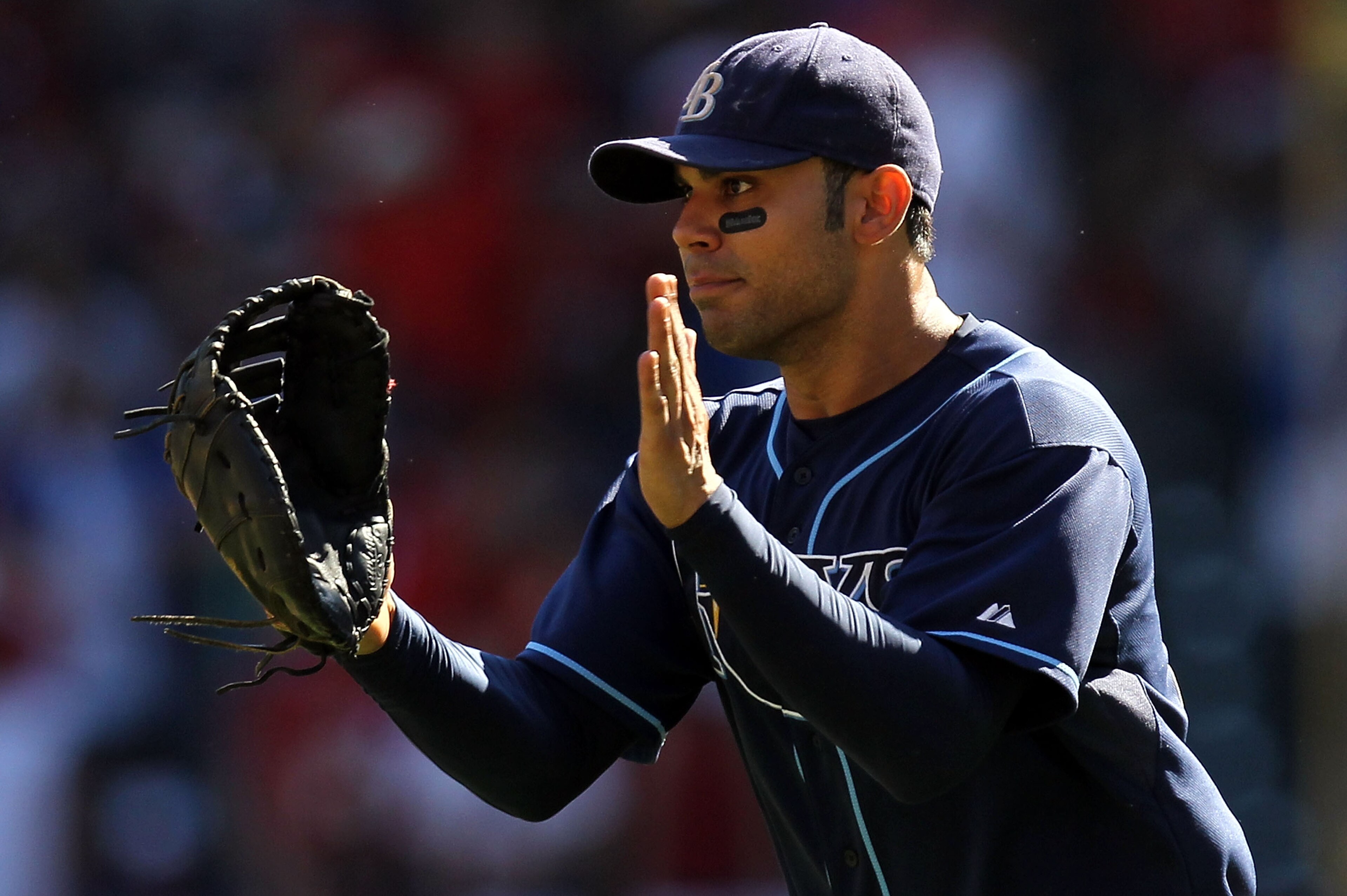 ARLINGTON, TX - OCTOBER 10: Carlos Pena #23 of the Tampa Bay Rays celebrates after a 5-2 win against the Texas Rangers during game 4 of the ALDS at Rangers Ballpark in Arlington on October 10, 2010 in Arlington, Texas. (Photo by Ronald Martinez/Getty Im ARLINGTON, TX - OCTOBER 10: Carlos Pena #23 of the Tampa Bay Rays celebrates after a 5-2 win against the Texas Rangers during game 4 of the ALDS at Rangers Ballpark in Arlington on October 10, 2010 in Arlington, Texas. (Photo by Ronald Martinez/Getty Im