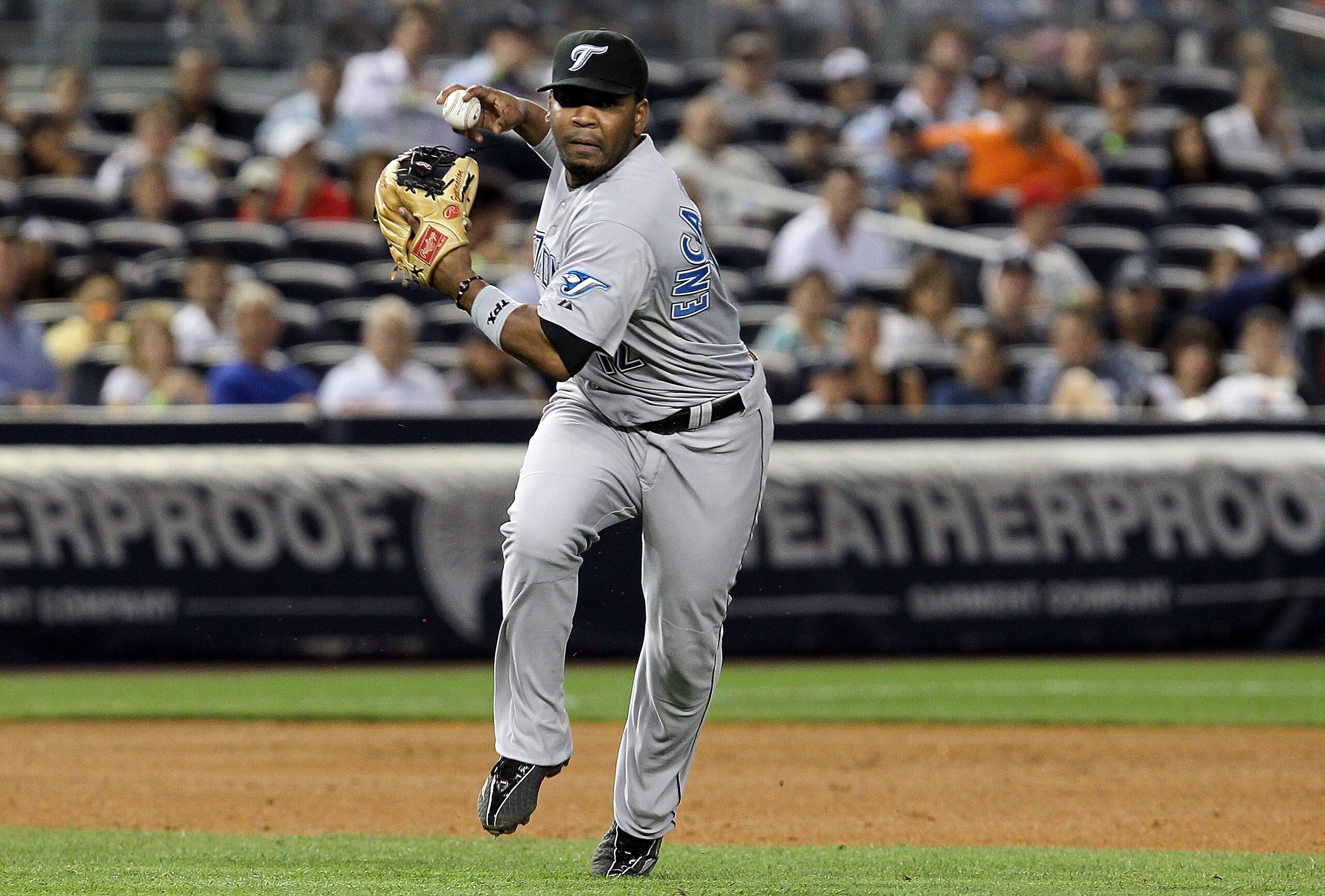 NEW YORK - AUGUST 03:  Edwin Encarnacion #12 of the Toronto Blue Jays in action against of the New York Yankees on August 3, 2010 at Yankee Stadium in the Bronx borough of New York City. The Jays defeated the Yankees 8-2.  (Photo by Jim McIsaac/Getty Imag