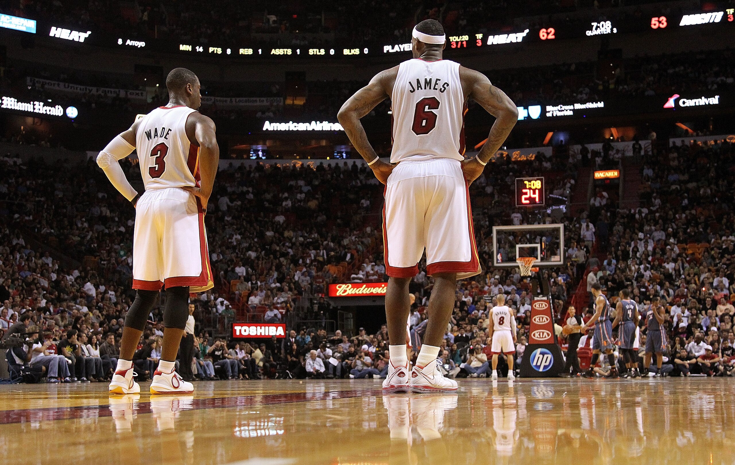 MIAMI - NOVEMBER 19:  Dwyane Wade #3 and LeBron James #6 of the Miami Heat look on during a game against the Charlotte Bobcats at American Airlines Arena on November 19, 2010 in Miami, Florida. NOTE TO USER: User expressly acknowledges and agrees that, by