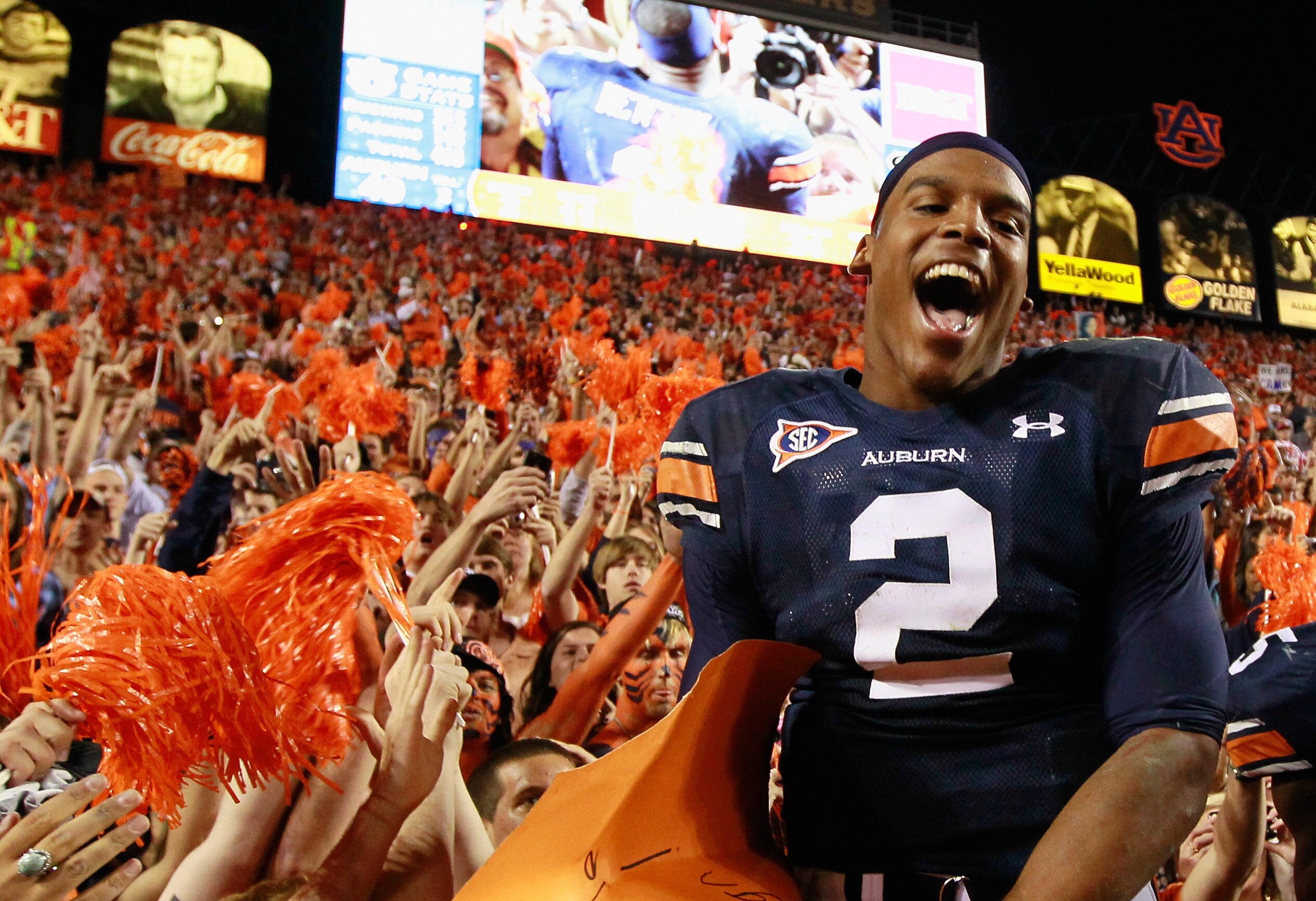 AUBURN, AL - NOVEMBER 13:  Quarterback Cameron Newton #2 of the Auburn Tigers celebrates with fans after their 49-31 win over the Georgia Bulldogs at Jordan-Hare Stadium on November 13, 2010 in Auburn, Alabama.  (Photo by Kevin C. Cox/Getty Images)