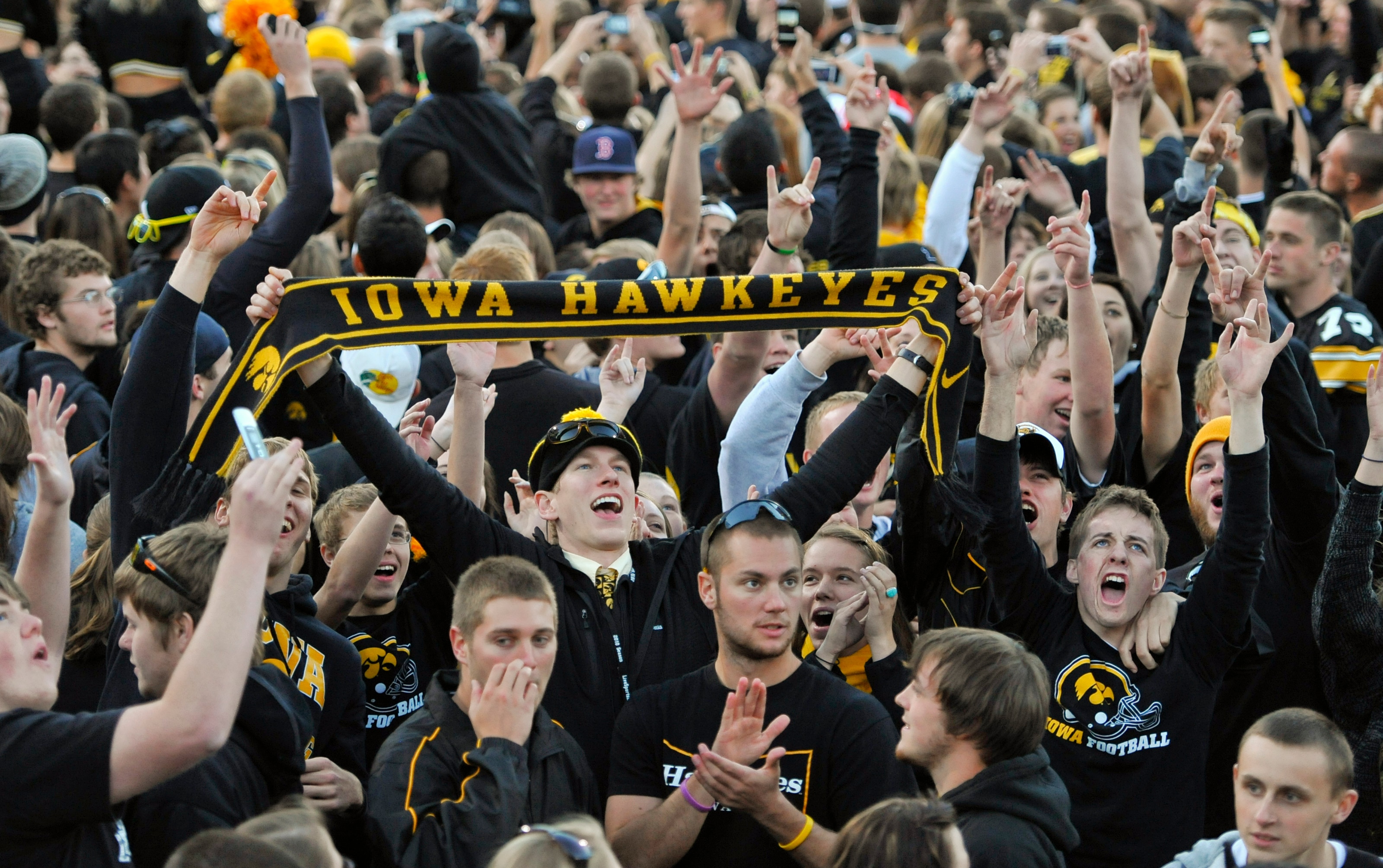 IOWA CITY, IA - OCTOBER 30: University of Iowa Hawkeyes fans celebrate their win over the Michigan State Spartans at Kinnick Stadium on October 30, 2010 in Iowa City, Iowa. Iowa won 37-6 over Michigan State. (Photo by David Purdy/Getty Images)