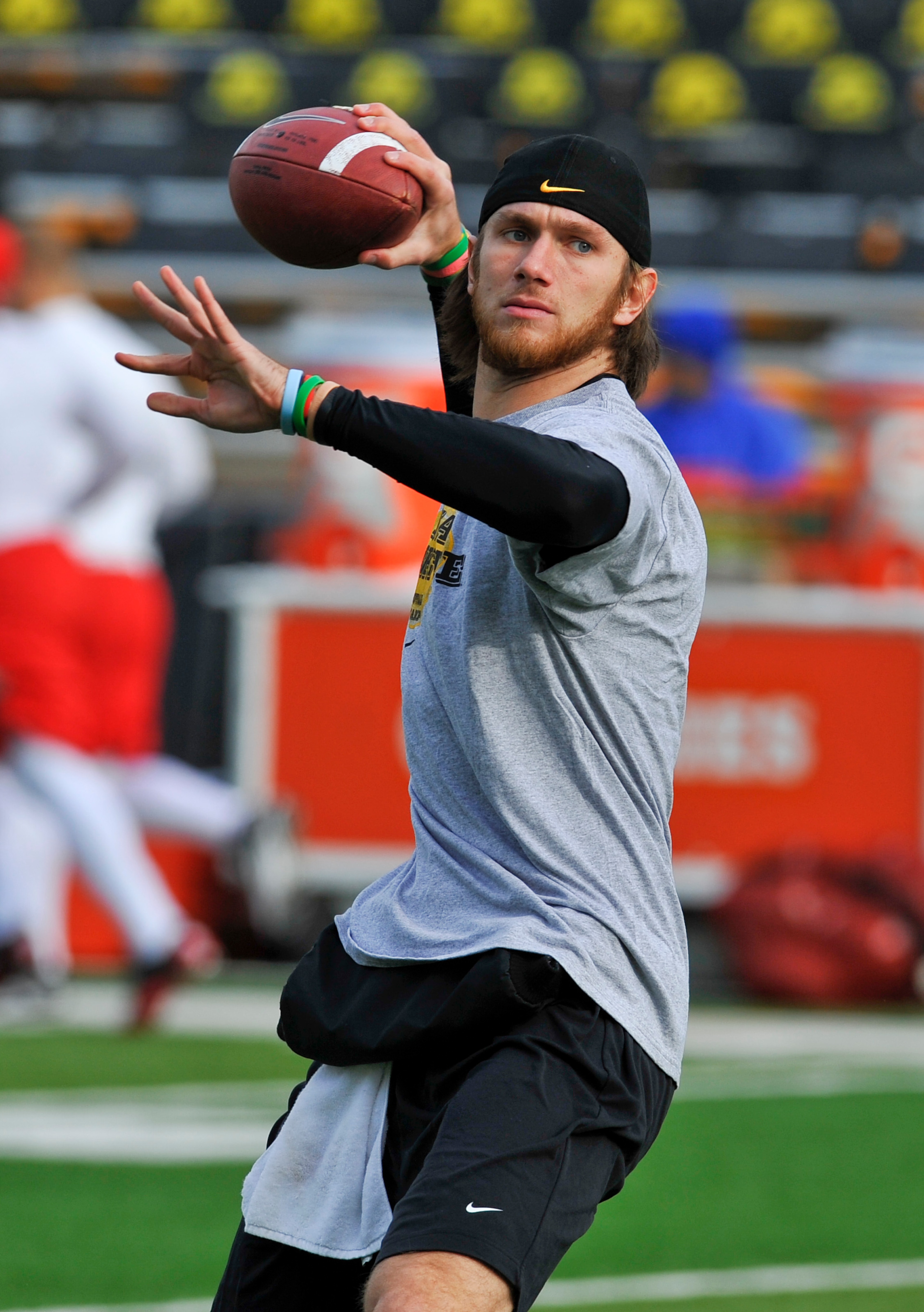 IOWA CITY, IA - NOVEMBER 20: Quarterback Ricky Stanzi #12 of the University of Iowa Hawkeyes throws during pre game warm ups before the NCAA football game against the Ohio State Buckeyes at Kinnick Stadium on November 20, 2010 in Iowa City, Iowa. Ohio wo IOWA CITY, IA - NOVEMBER 20: Quarterback Ricky Stanzi #12 of the University of Iowa Hawkeyes throws during pre game warm ups before the NCAA football game against the Ohio State Buckeyes at Kinnick Stadium on November 20, 2010 in Iowa City, Iowa. Ohio wo