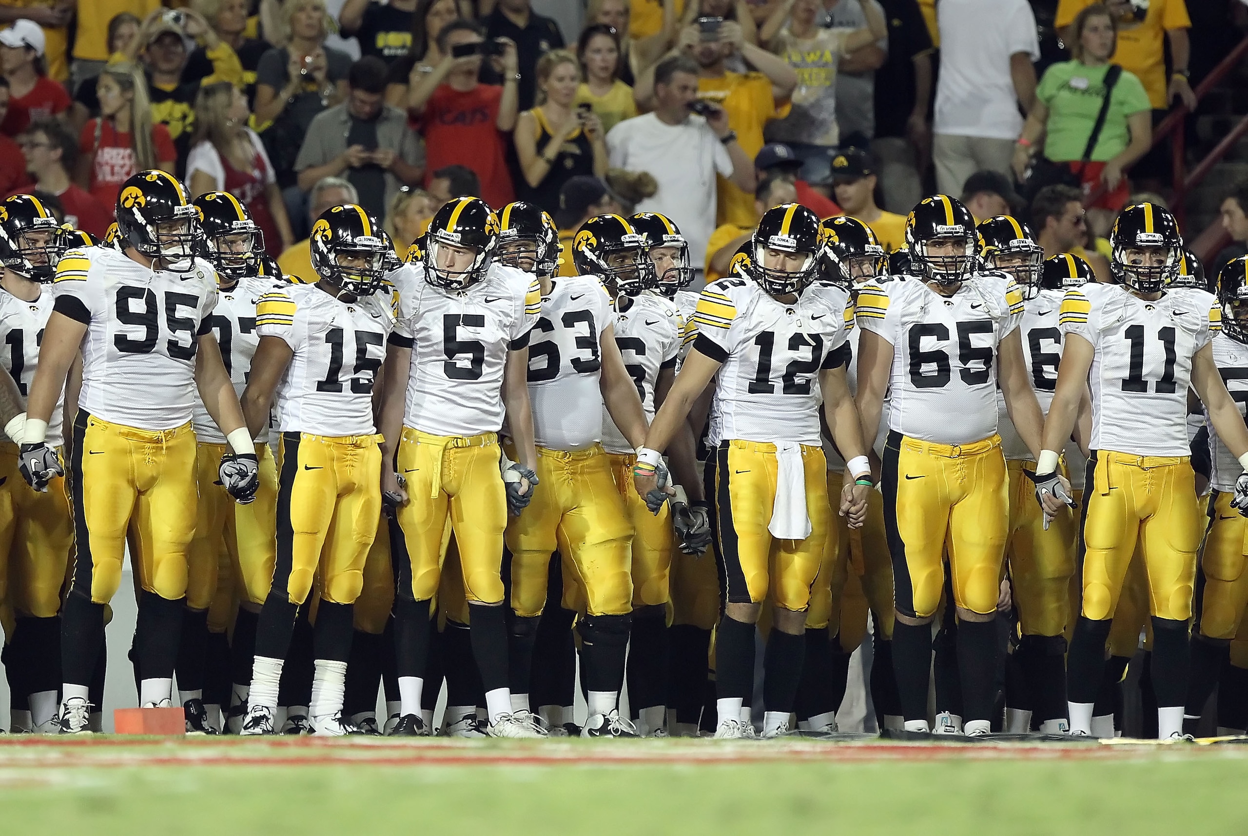 TUCSON, AZ - SEPTEMBER 18:  The Iowa Hawkeyes line up before the college football game against the Arizona Wildcats at Arizona Stadium on September 18, 2010 in Tucson, Arizona. The Wildcats defeated the Hawkeyes 34-27.  (Photo by Christian Petersen/Getty