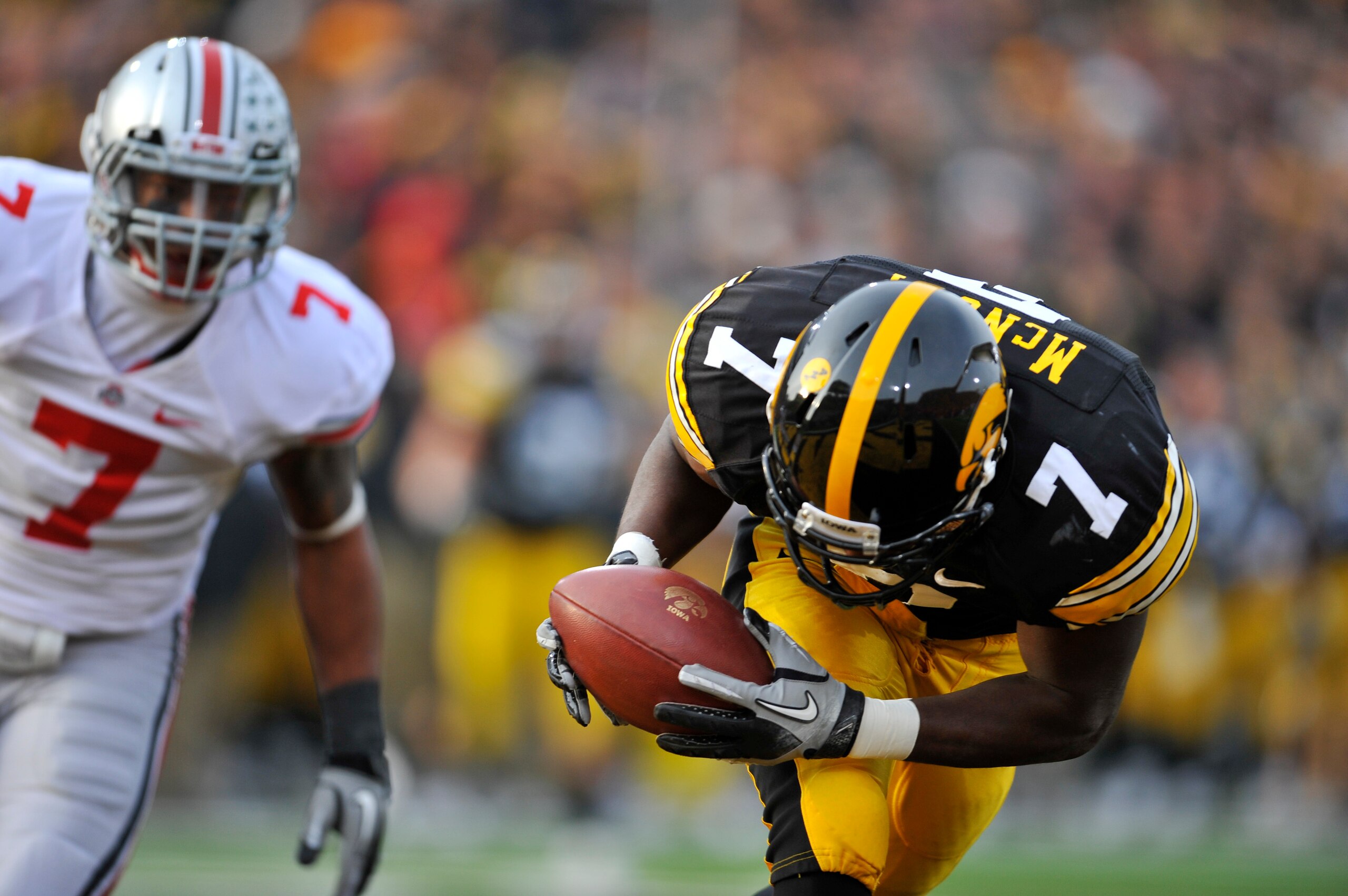 IOWA CITY, IA - NOVEMBER 20: Wide receiver Marvin McNutt #7 of the University of Iowa Hawkeyes pulls in a touchdown pass as defensive back Jermale Hines #7 of the Ohio State Buckeyes defends during the first half of play at Kinnick Stadium on November 20,