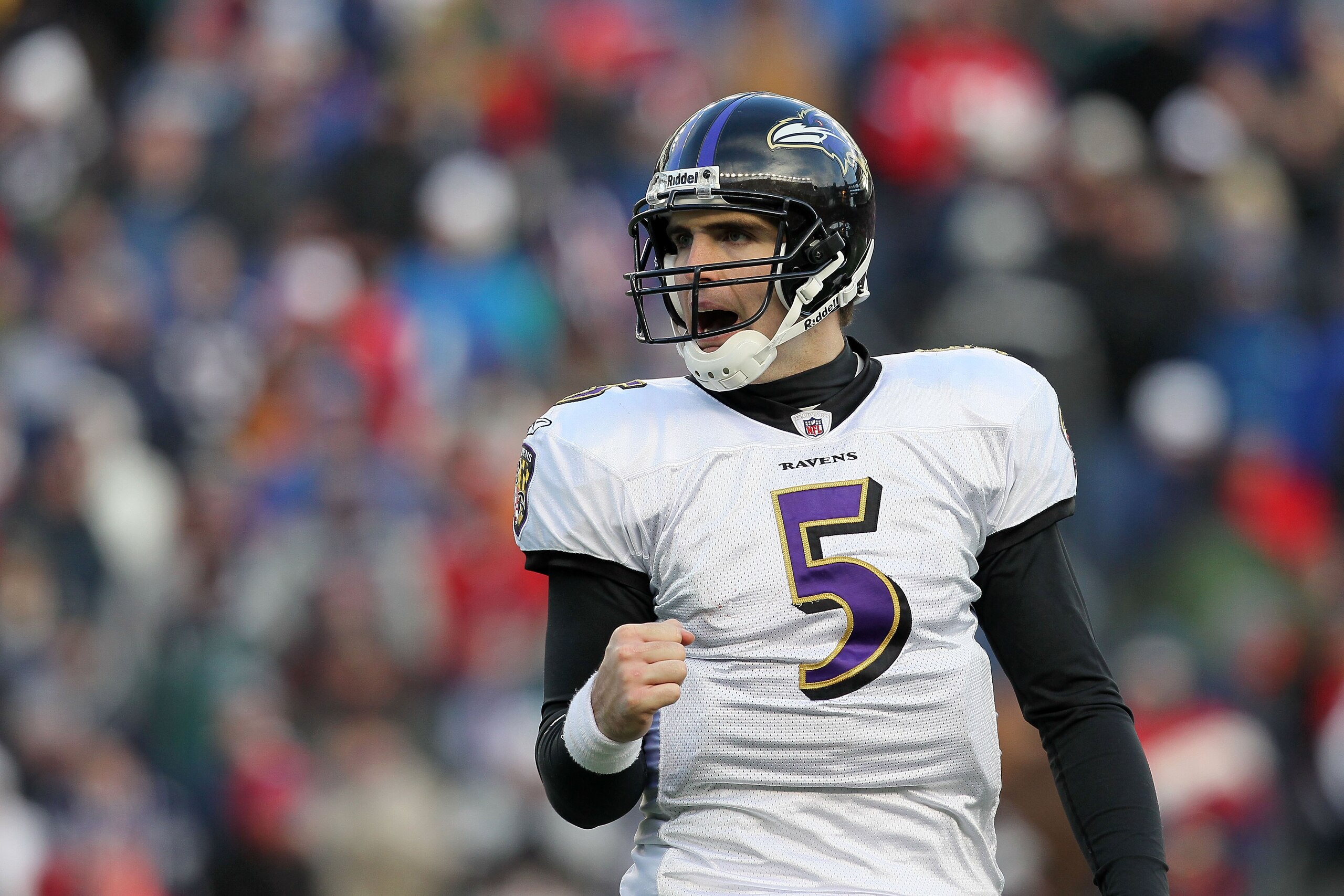 FOXBORO, MA - JANUARY 10:  Quarterback Joe Flacco #5 of the Baltimore Ravens reacts after the Ravens scored a touchdown against the New England Patriots during the 2010 AFC wild-card playoff game at Gillette Stadium on January 10, 2010 in Foxboro, Massach