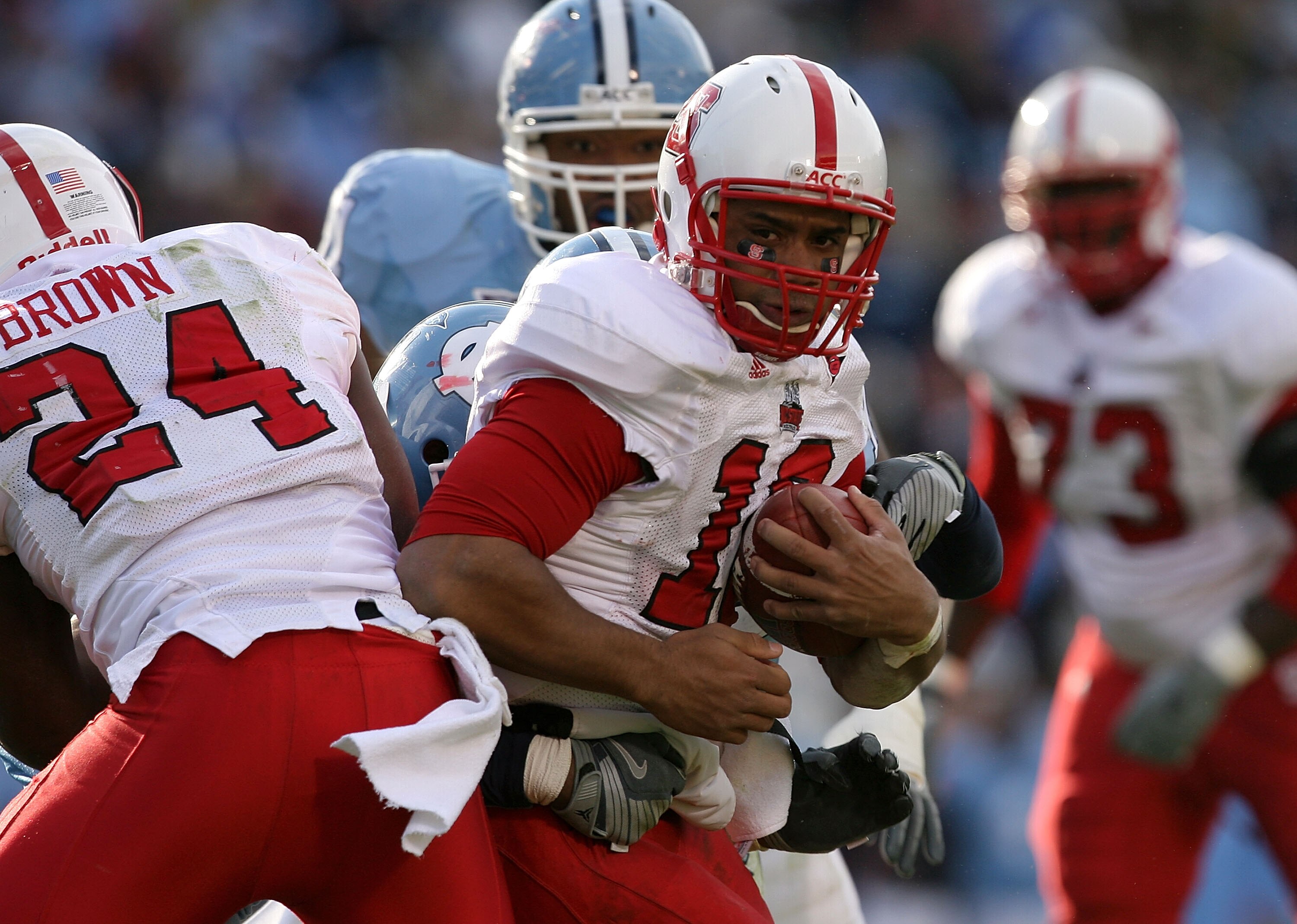 CHAPEL HILL, NC - NOVEMBER 22:  Russell Wilson #16 of the North Carolina State Wolfpack runs with the ball against the North Carolina Tar Heels at Kenan Stadium on November 22, 2008 in Chapel Hill, North Carolina.  (Photo by Streeter Lecka/Getty Images)