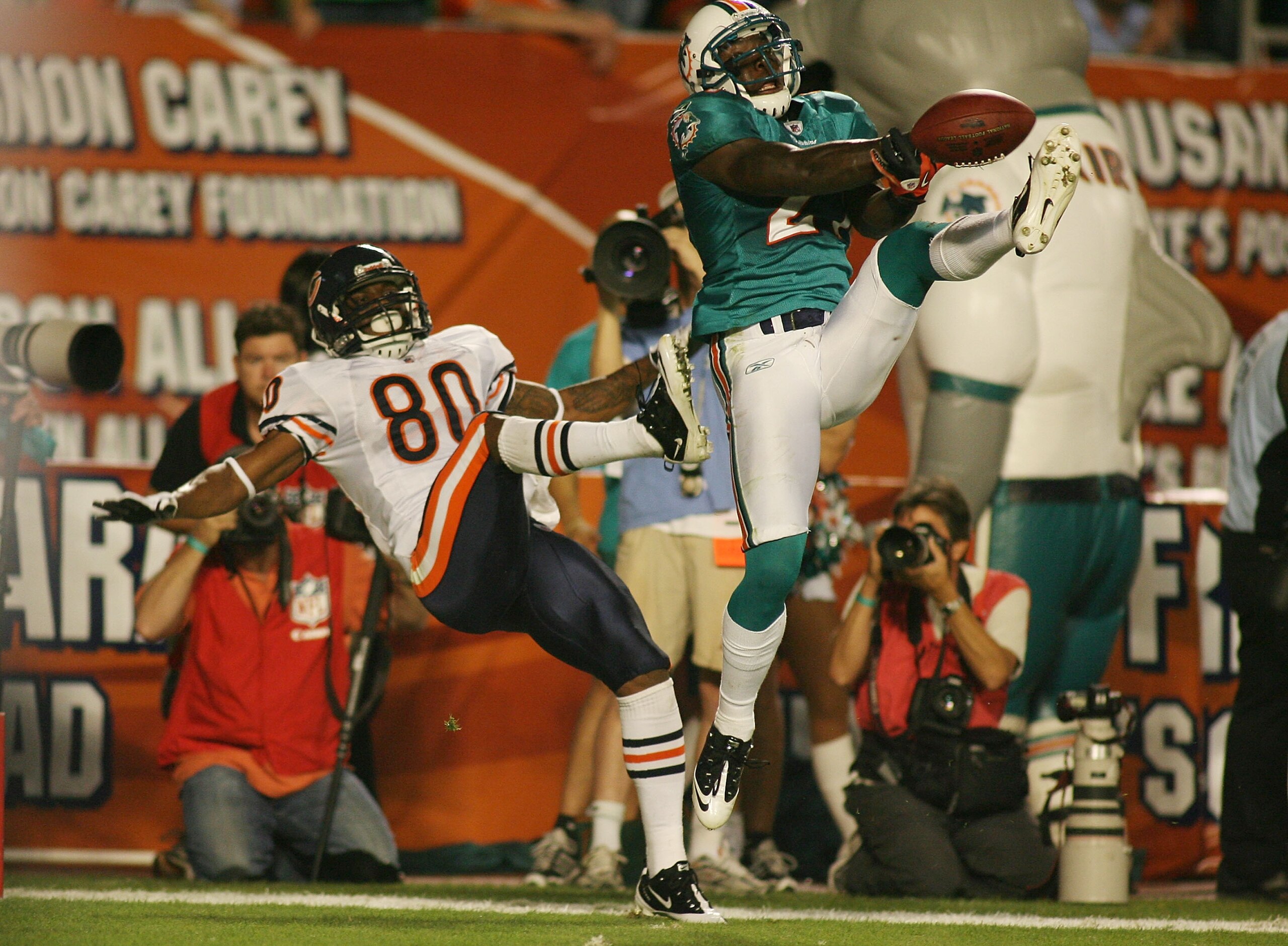 MIAMI - NOVEMBER 18:  Receiver Earl Bennett #80 of the Chicago Bears misses the catch as cornerback Vonte Davis #21 of the Miami Dolphins defends at Sun Life Stadium on November 18, 2010 in Miami, Florida.  (Photo by Marc Serota/Getty Images)