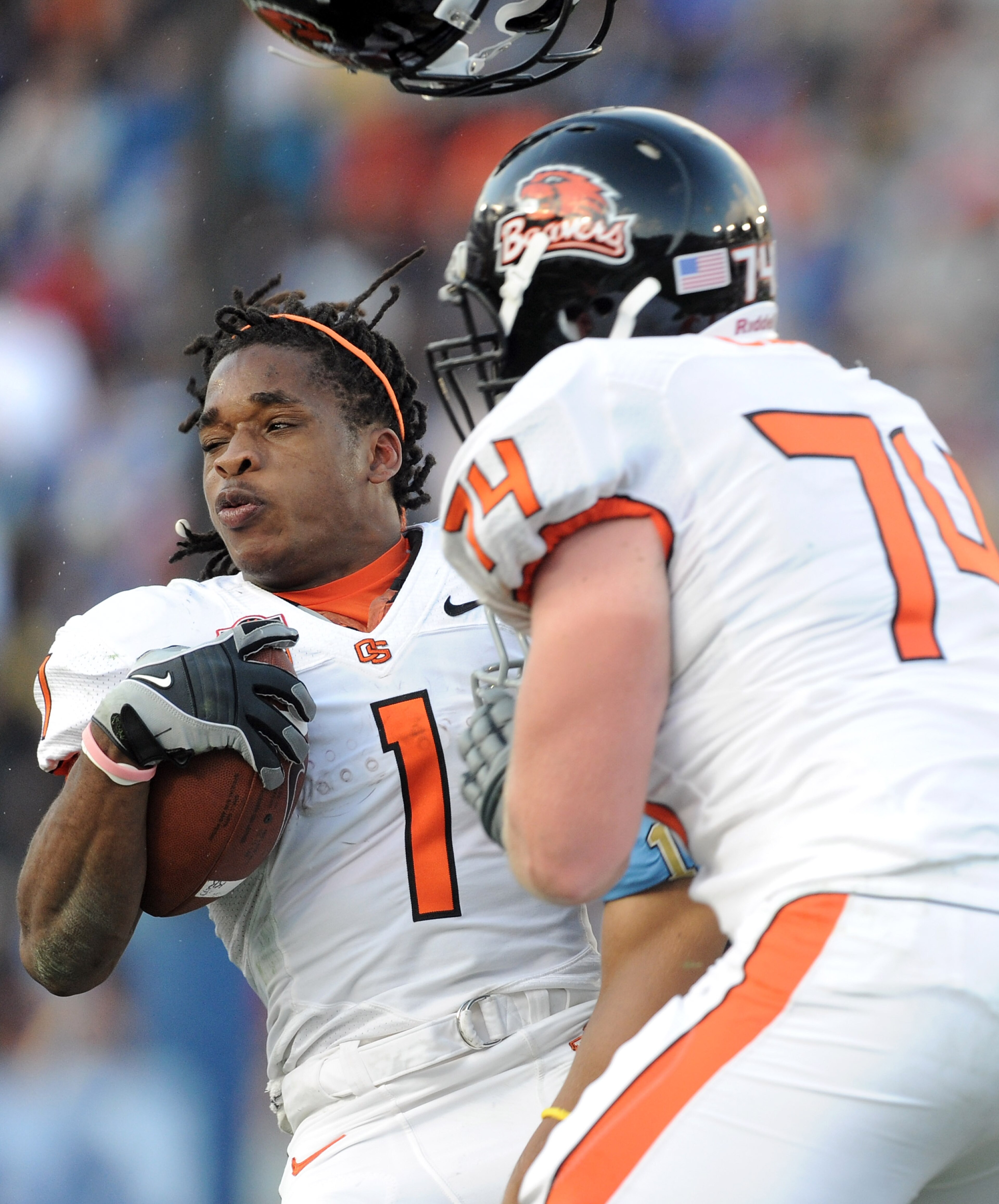 PASADENA, CA - NOVEMBER 06: Jacquizz Rodgers #1 of the Oregon State Beavers loses his helmet after a hit from Dietrich Riley #1 of the UCLA Bruins during the second quarter at the Rose Bowl on November 6, 2010 in Pasadena, California. (Photo by Harry Ho PASADENA, CA - NOVEMBER 06: Jacquizz Rodgers #1 of the Oregon State Beavers loses his helmet after a hit from Dietrich Riley #1 of the UCLA Bruins during the second quarter at the Rose Bowl on November 6, 2010 in Pasadena, California. (Photo by Harry Ho