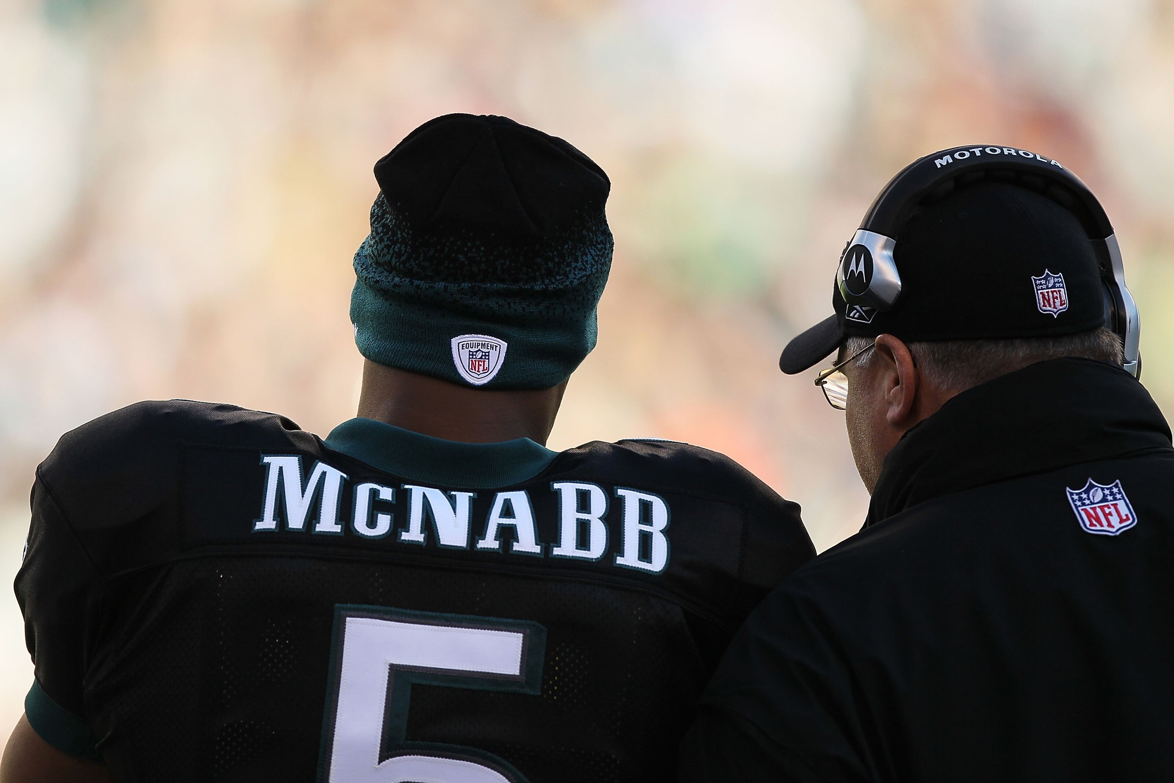 PHILADELPHIA - NOVEMBER 29:  Donovan McNabb #5 of the Philadelphia Eagles stands with Head Coach Andy Reid from the sidelines against the Washington Redskins during their game at Lincoln Financial Field on November 29, 2009 in Philadelphia, Pennsylvania.