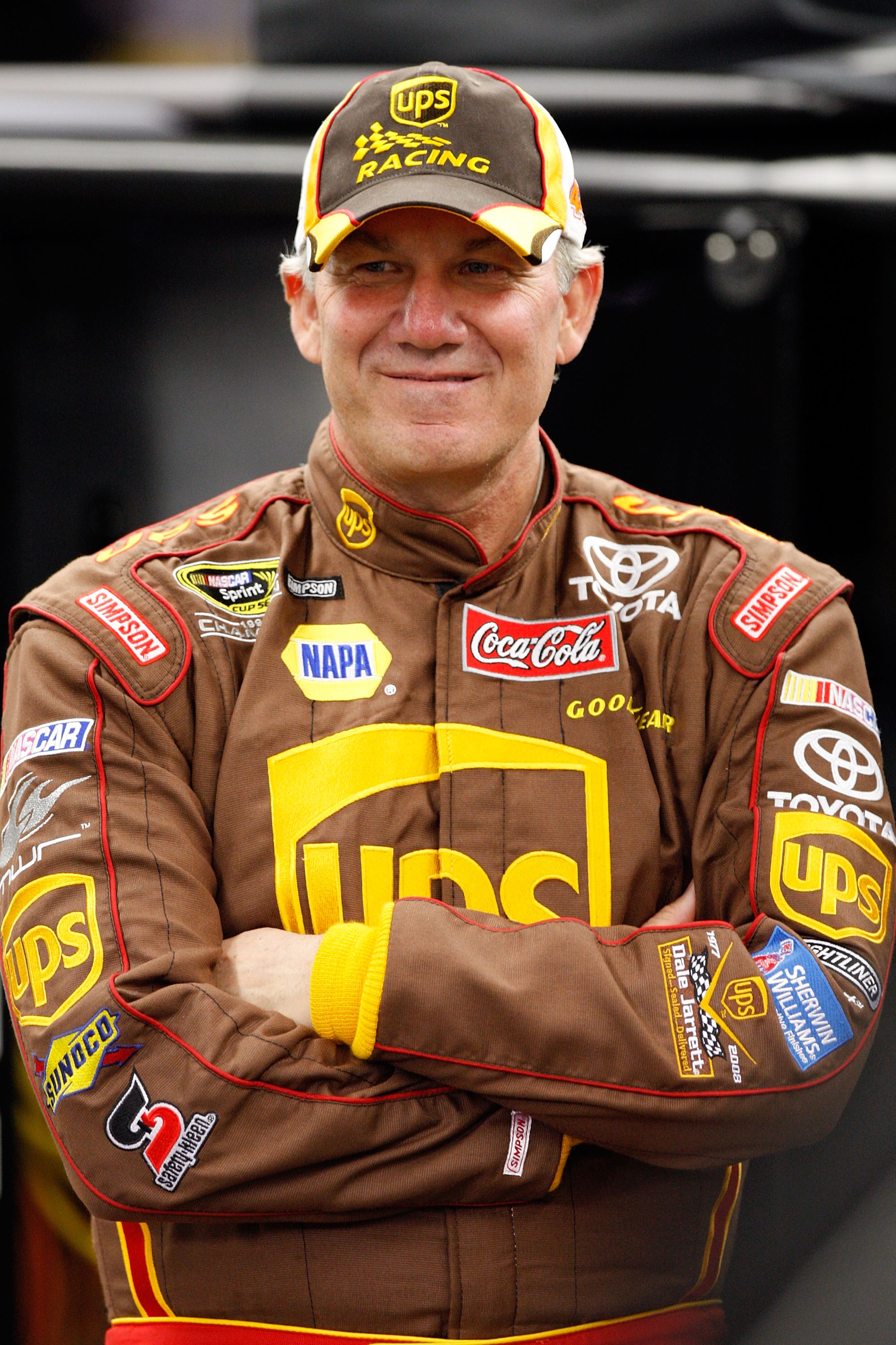 DAYTONA BEACH, FL - FEBRUARY 08: Dale Jarrett, driver of the #44 UPS Toyota, stands in the garage during practices for the Budweiser Shootout at Daytona International Speedway on February 8, 2008 in Daytona, Florida.  (Photo by John Harrelson/Getty Images
