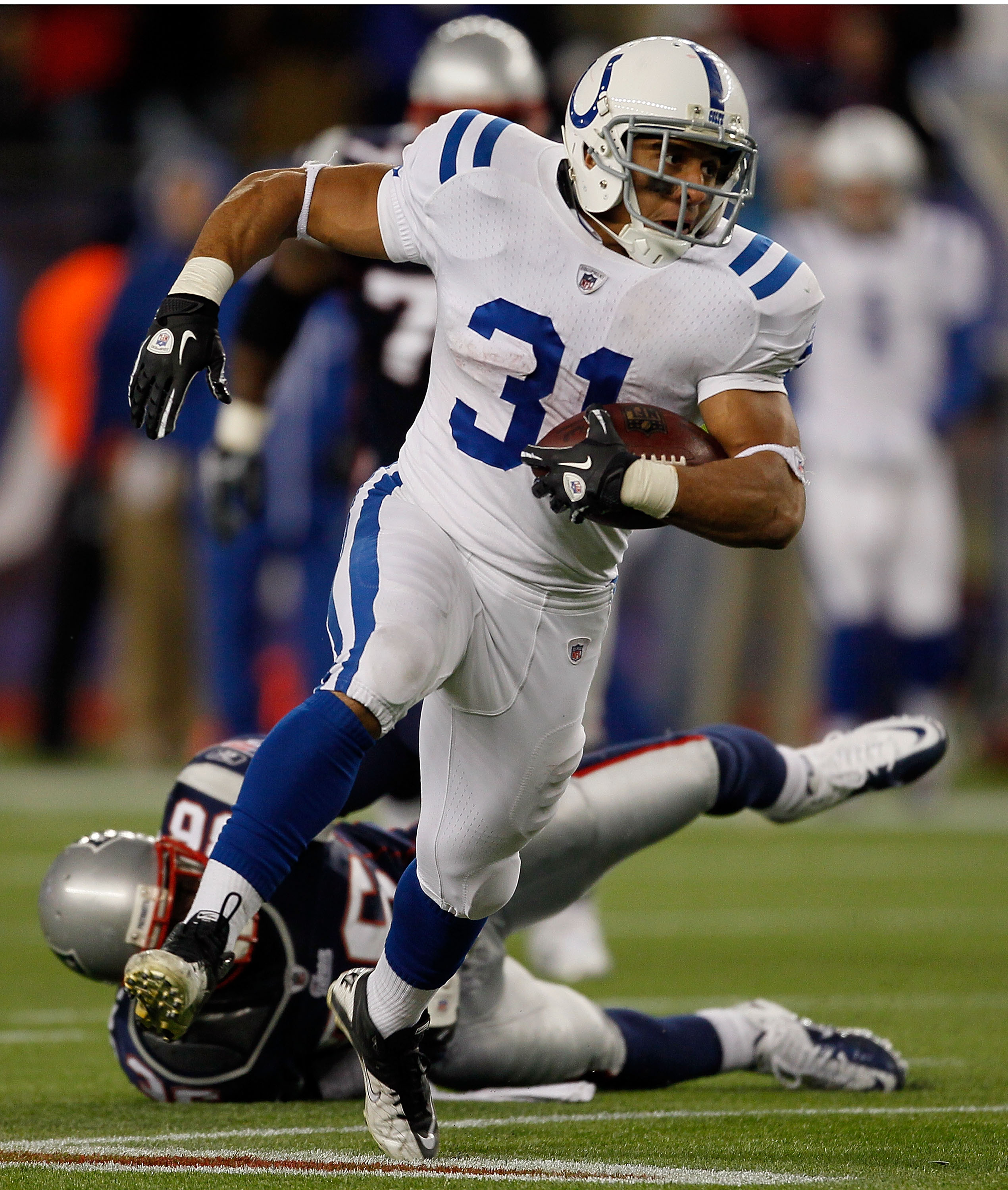 FOXBORO, MA - NOVEMBER 21: Donald Brown #31 of the Indianapolis Colts runs against the New England Patriots at Gillette Stadium on November 21, 2010 in Foxboro, Massachusetts. (Photo by Jim Rogash/Getty Images) FOXBORO, MA - NOVEMBER 21: Donald Brown #31 of the Indianapolis Colts runs against the New England Patriots at Gillette Stadium on November 21, 2010 in Foxboro, Massachusetts. (Photo by Jim Rogash/Getty Images)