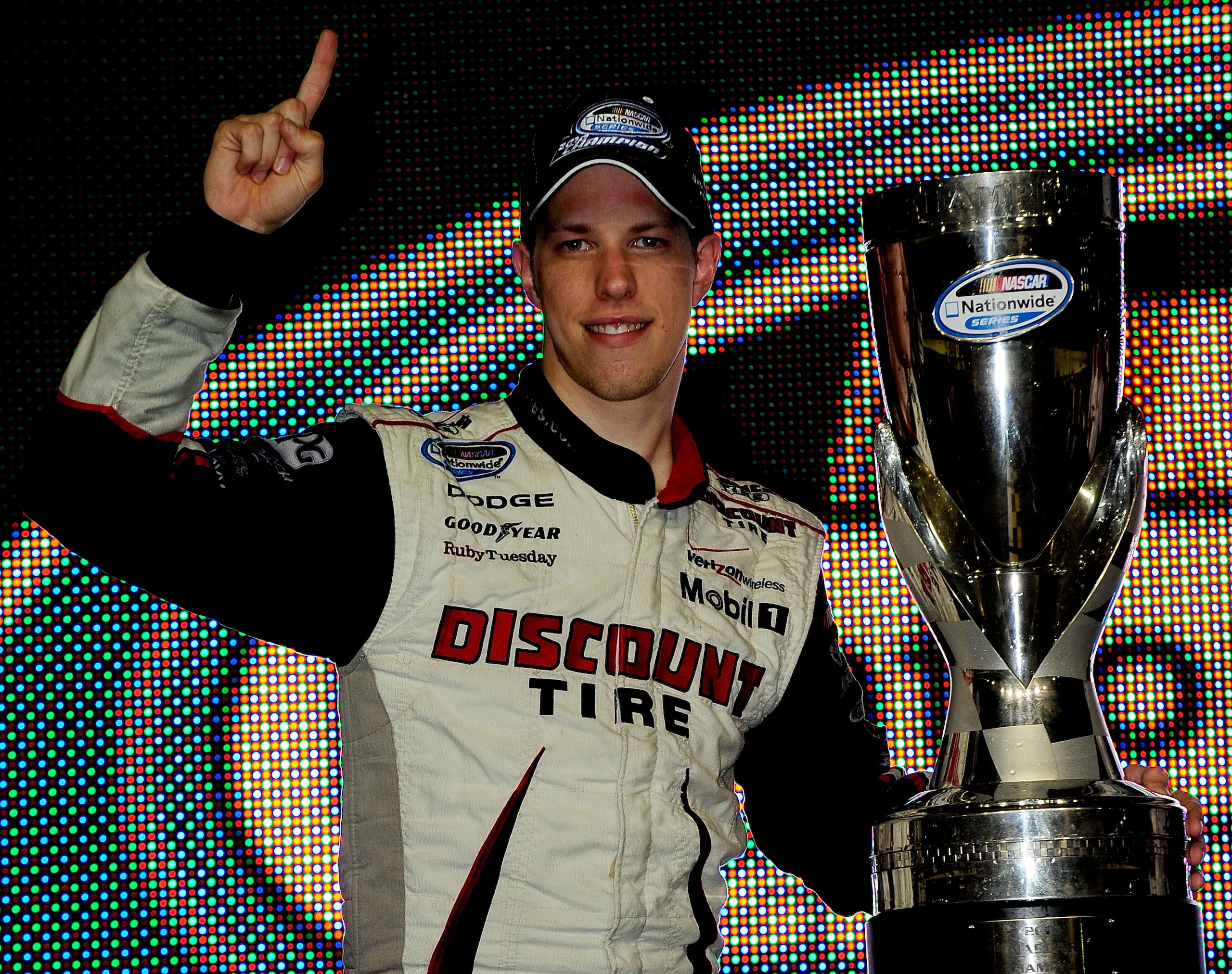 HOMESTEAD, FL - NOVEMBER 20:  Brad Keselowski, driver of the #22 Discount Tire Dodge, celebrates winning the NASCAR Nationwide Series championship following the Ford 300 at Homestead-Miami Speedway on November 20, 2010 in Homestead, Florida.  (Photo by Ru
