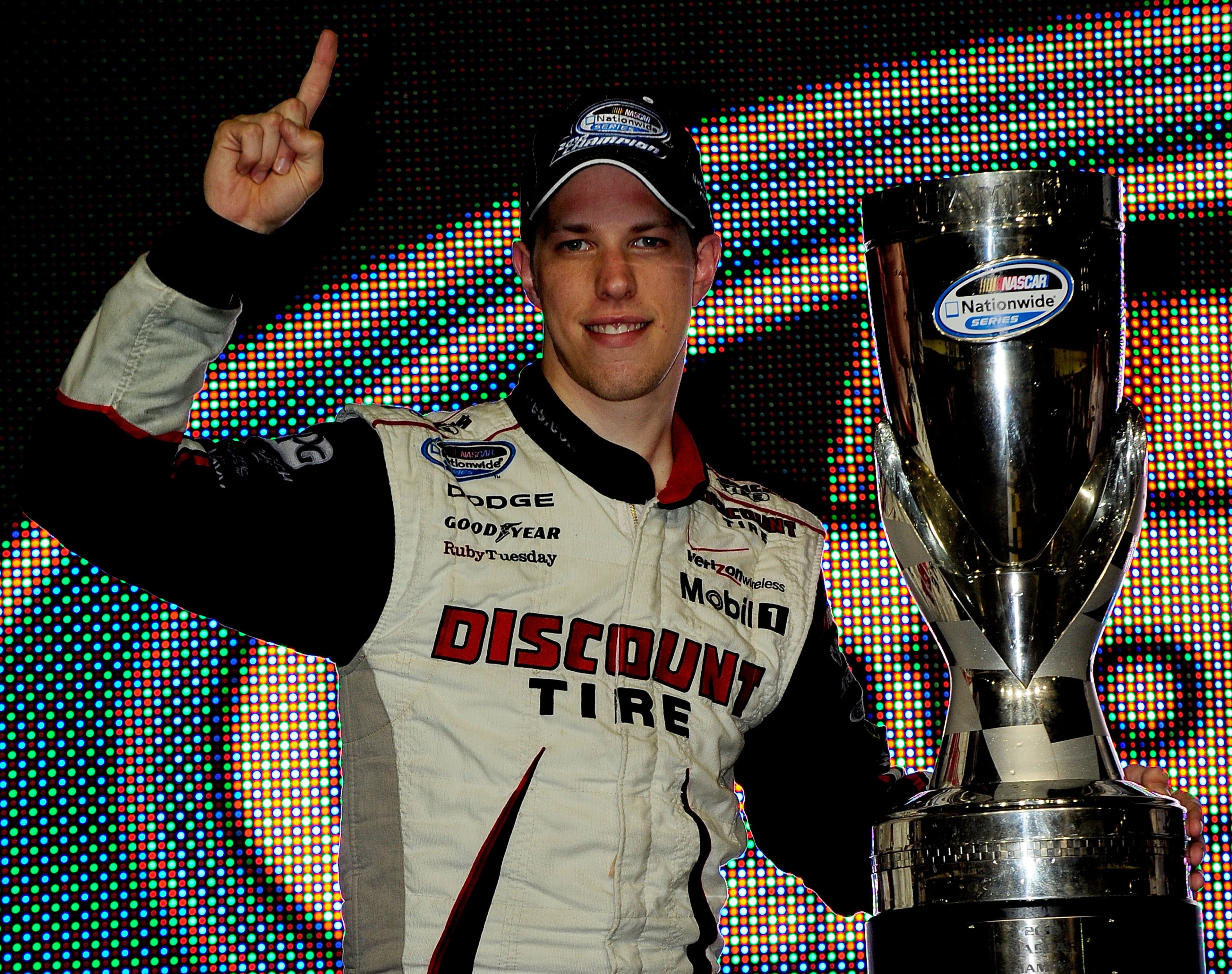 HOMESTEAD, FL - NOVEMBER 20:  Brad Keselowski, driver of the #22 Discount Tire Dodge, celebrates winning the NASCAR Nationwide Series championship following the Ford 300 at Homestead-Miami Speedway on November 20, 2010 in Homestead, Florida.  (Photo by Ru
