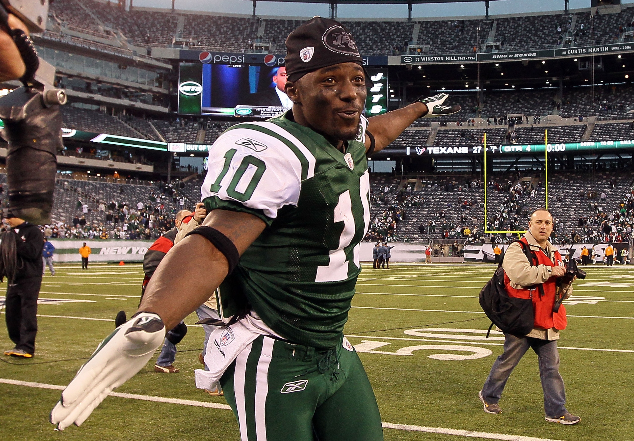 EAST RUTHERFORD, NJ - NOVEMBER 21: Santonio Holmes #10 of the New York Jets celebrates after defeating the Houston Texans on November 21, 2010 at the New Meadowlands Stadium in East Rutherford, New Jersey. The Jets defeated the Texans 30-27.  (Photo by Ji