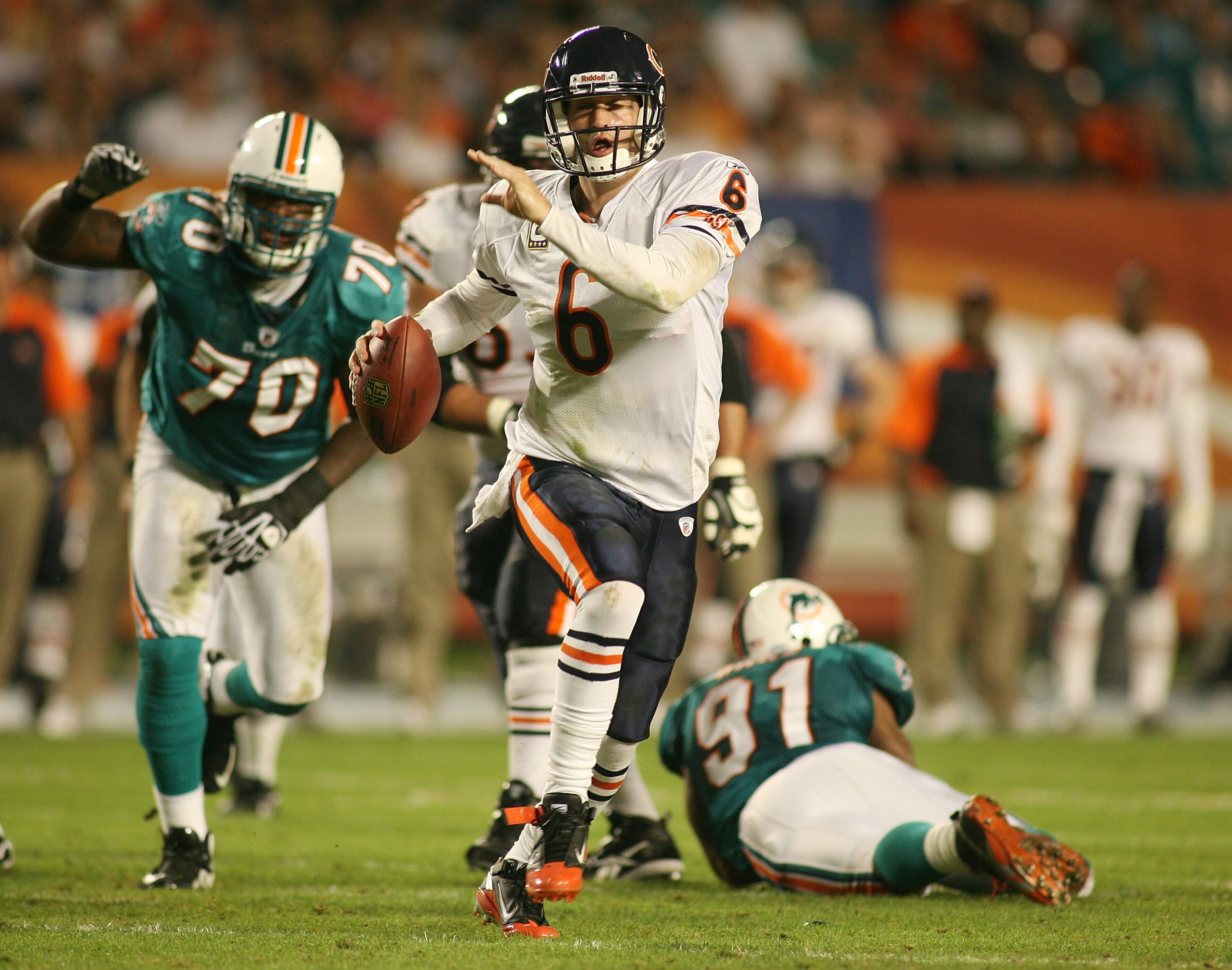 MIAMI - NOVEMBER 18:  Quarterback Jay Cutler #6 of the Chicago Bears scrambles against the Miami Dolphins at Sun Life Stadium on November 18, 2010 in Miami, Florida.  (Photo by Marc Serota/Getty Images)