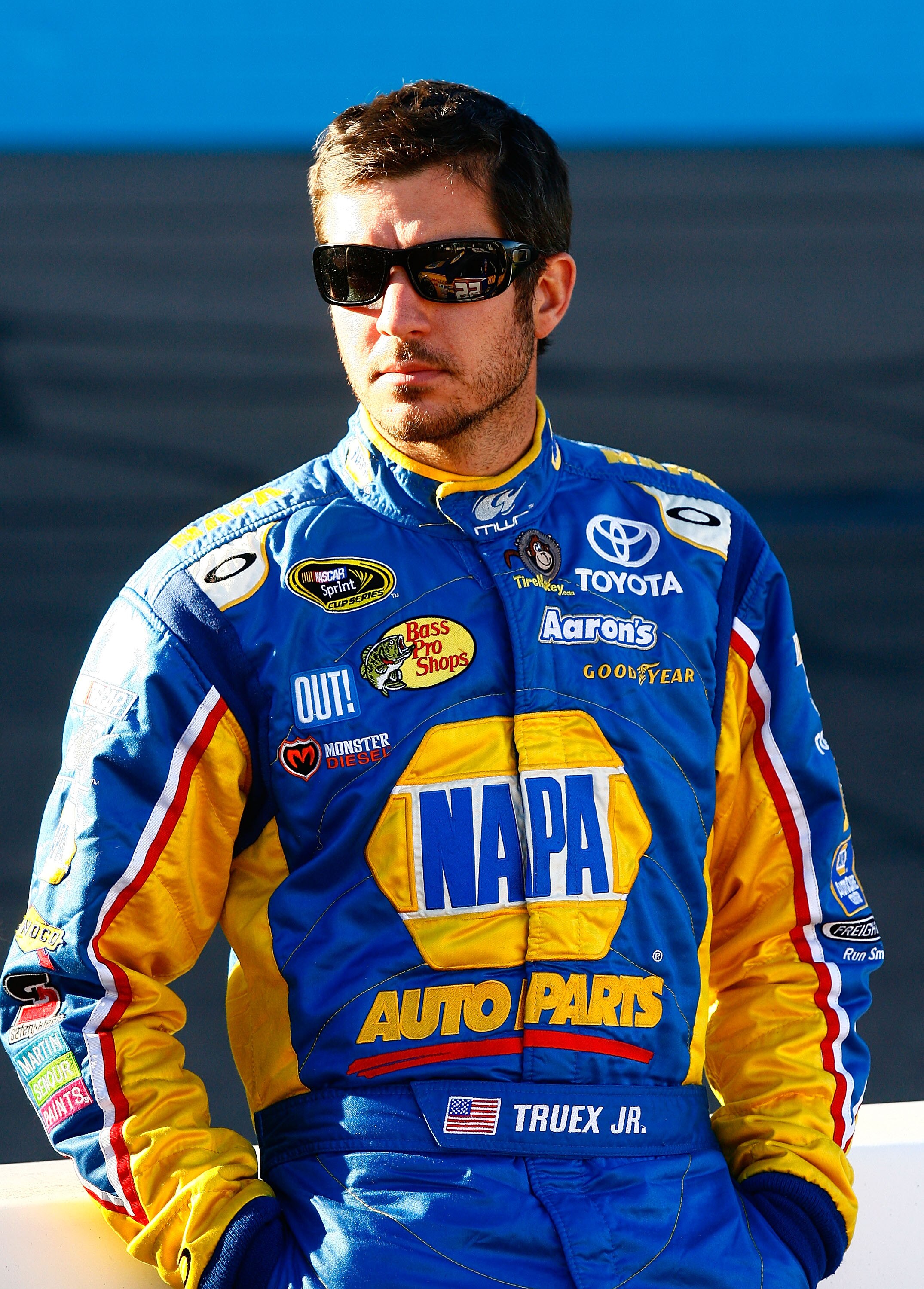AVONDALE, AZ - NOVEMBER 12:  Martin Truex Jr., driver of the #56 NAPA Toyota, stands on pit road during qualifying for the NASCAR Sprint Cup Series Kobalt Tools 500 at Phoenix International Raceway on November 12, 2010 in Avondale, Arizona.  (Photo by Jas