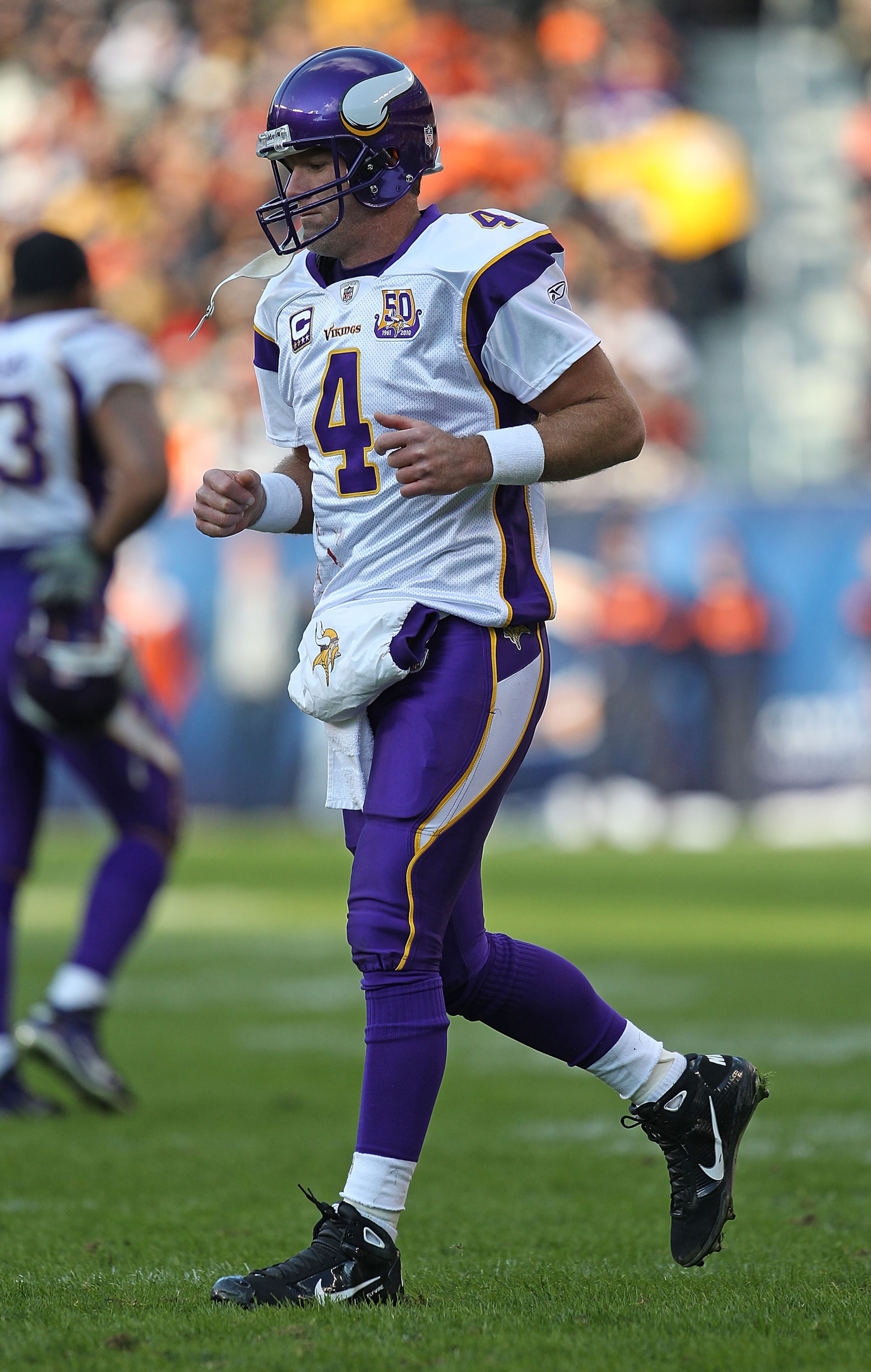 CHICAGO - NOVEMBER 14: Brett Favre #4 of the Minnesota Vikings walks back to the field of play from the sidelines during a game against the Chicago Bears at Soldier Field on November 14, 2010 in Chicago, Illinois. The Bears defeated the Vikings 27-13. (Ph