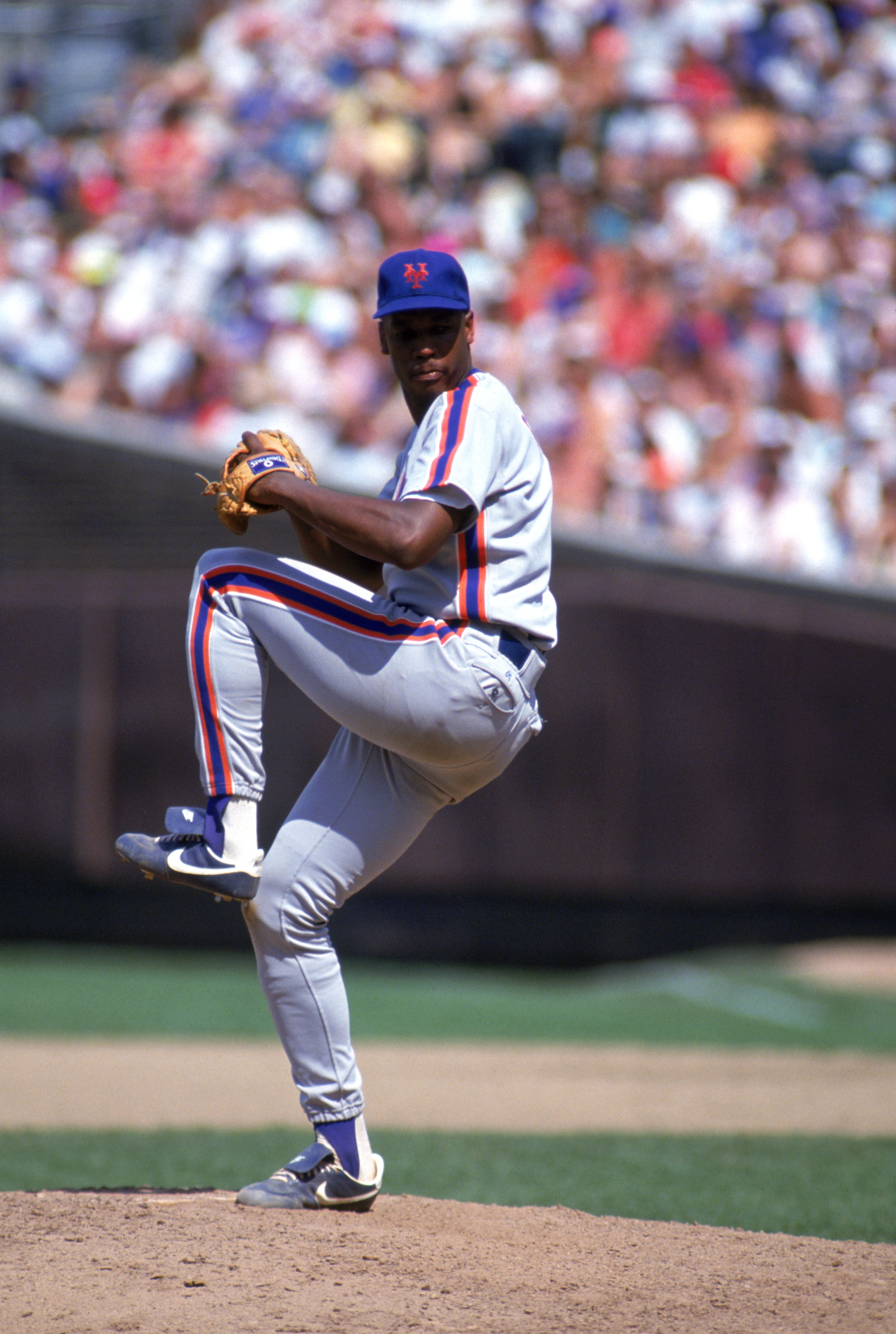 CHICAGO - 1990:  Dwight Gooden #16 of the New York Mets delivers a pitch during a game against the Chicago Cubs in 1990 at Wrigley field in Chicago, Illinois.  (Photo by Jonathan Daniel/Getty Images)