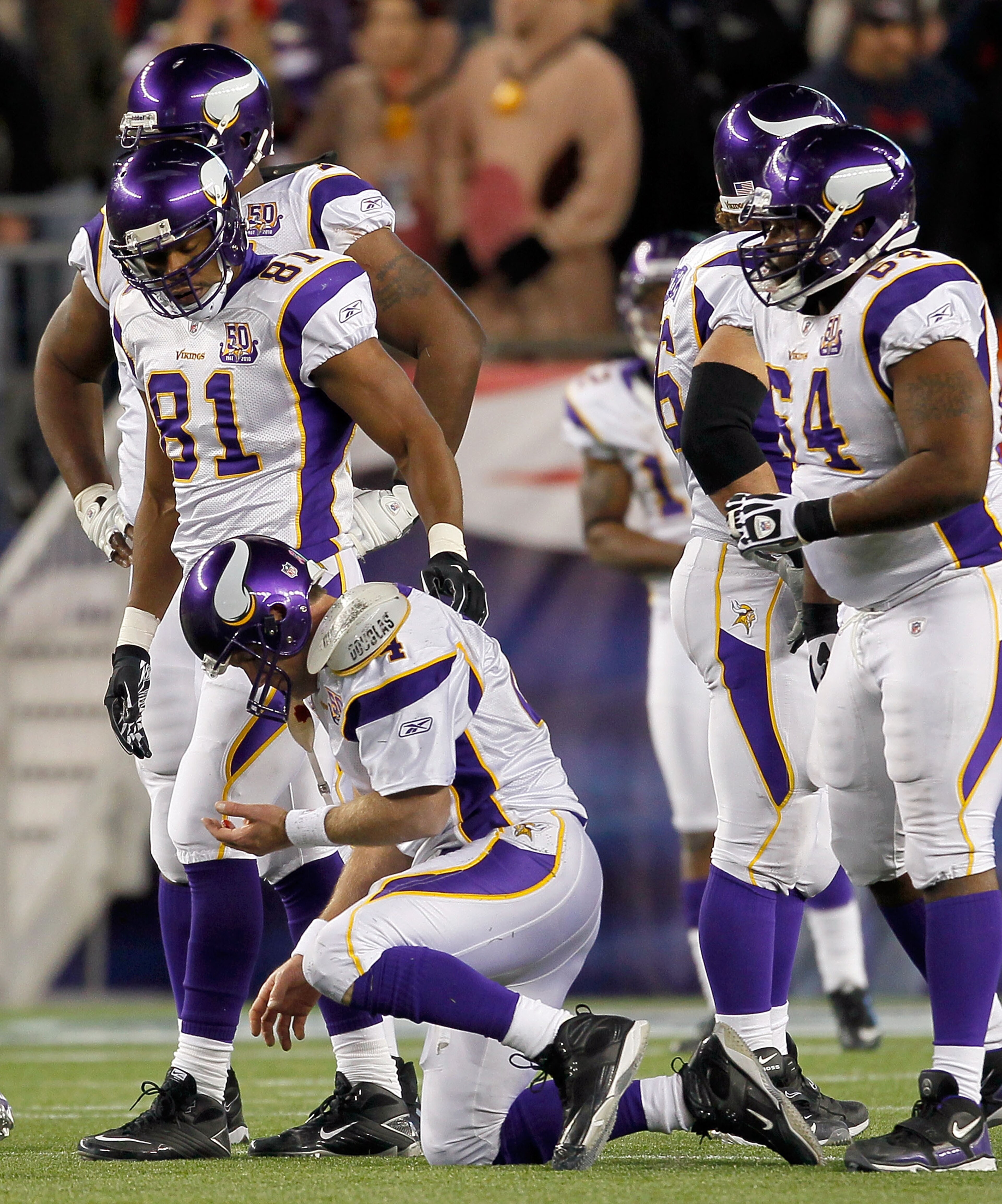 FOXBORO, MA - OCTOBER 31:  Brett Favre #4 of the Minnesota Vikings has difficulty walking to the bench after he was hit by Myron Pryor #91 of the New England Patriots in the fourth quarter at Gillette Stadium on October 31, 2010 in Foxboro, Massachusetts.
