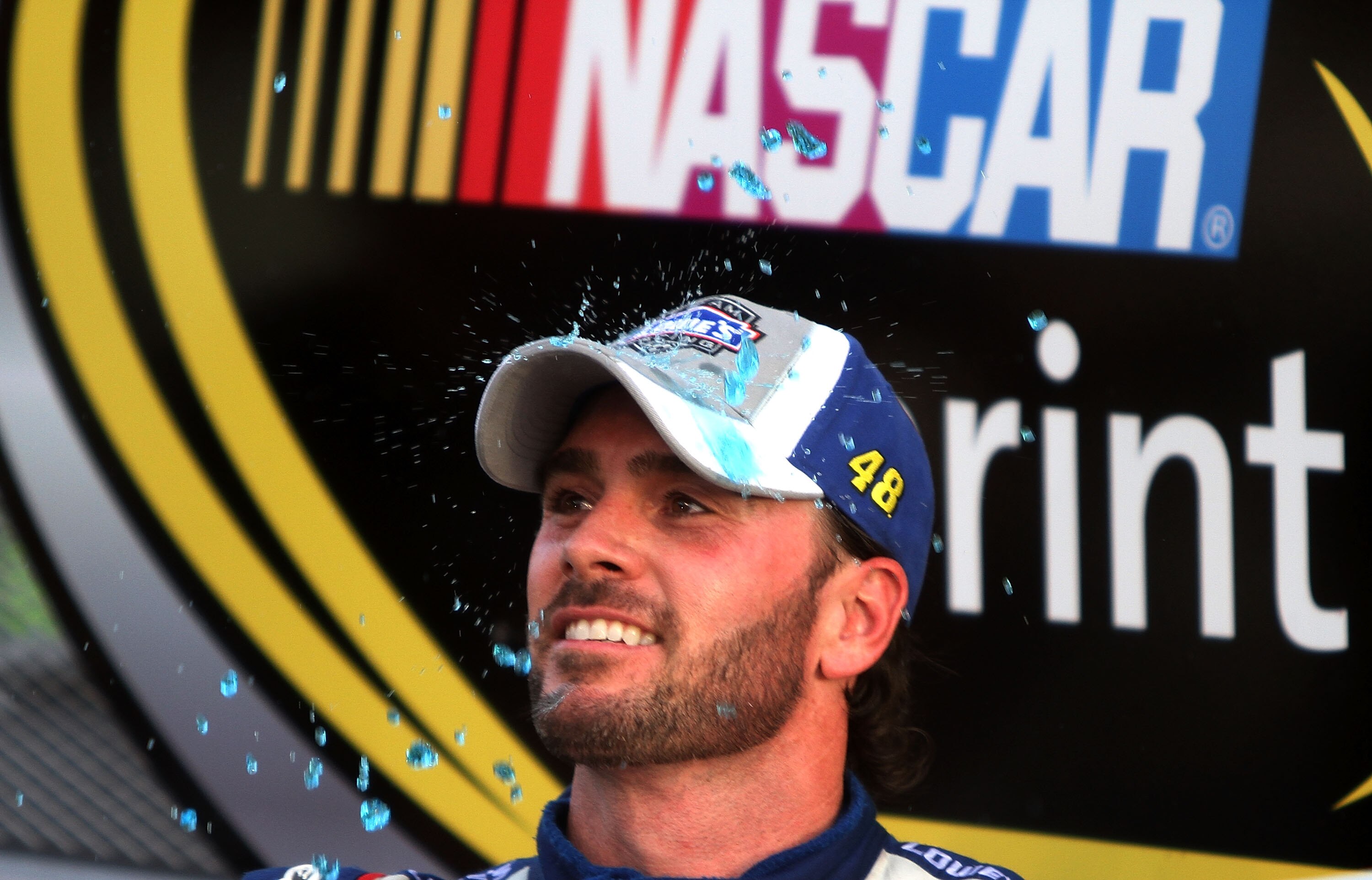 HOMESTEAD, FL - NOVEMBER 21:  Jimmie Johnson, driver of the #48 Lowe's Chevrolet, celebrates after finishing in second place in the Ford 400 to clinch his fifth consecutive NASCAR Sprint Cup championship at Homestead-Miami Speedway on November 21, 2010 in