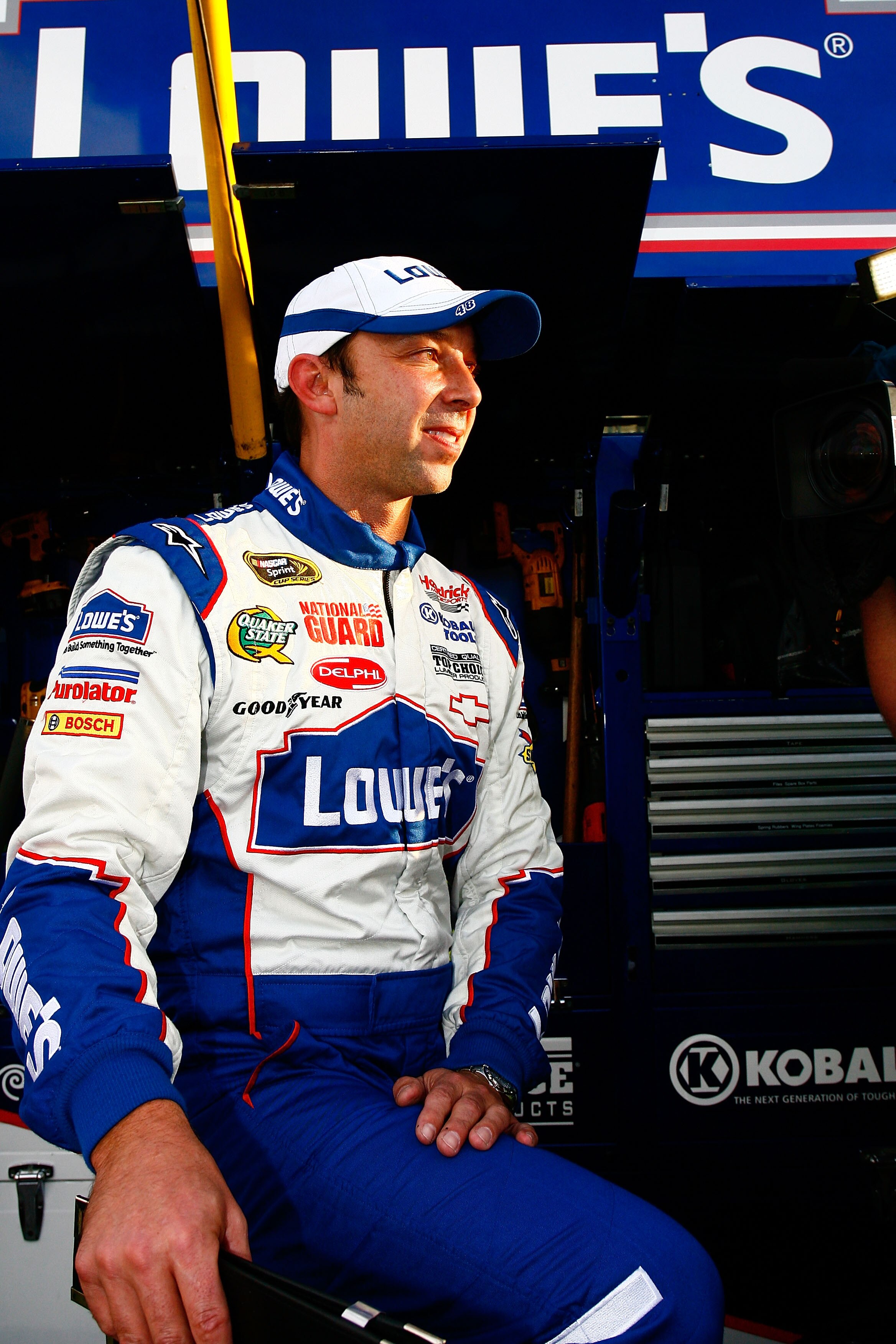 HOMESTEAD, FL - NOVEMBER 21:  Chad Knaus , crew chief for Jimmie Johnson, driver of the #48 Lowe's Chevrolet, smiles after finishing in second place in the Ford 400 to clinch a fifth consecutive NASCAR Sprint Cup championship at Homestead-Miami Speedway o
