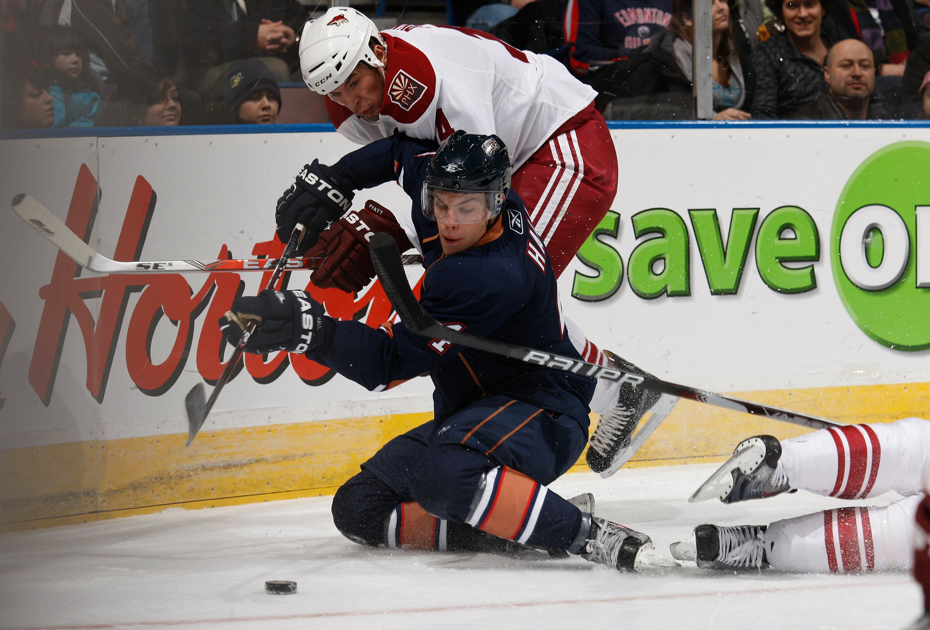EDMONTON, CANADA - NOVEMBER 19: Taylor Hall #4 of the Edmonton Oilers fights off Taylor Pyatt #14 of the Phoenix Coyotes at Rexall Place November 19, 2010 in Edmonton, Alberta, Canada. (Photo by Dale MacMillan/Getty Images)