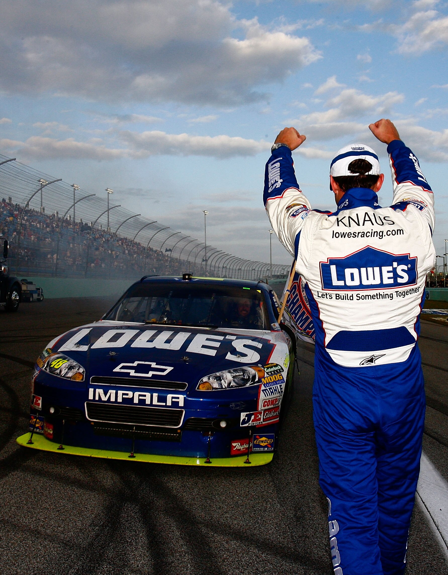 HOMESTEAD, FL - NOVEMBER 21:  Crew chief Chad Knaus and Jimmie Johnson, driver of the #48 Lowe's Chevrolet, celebrate after finishing in second place in the Ford 400 to clinch a fifth consecutive NASCAR Sprint Cup championship at Homestead-Miami Speedway