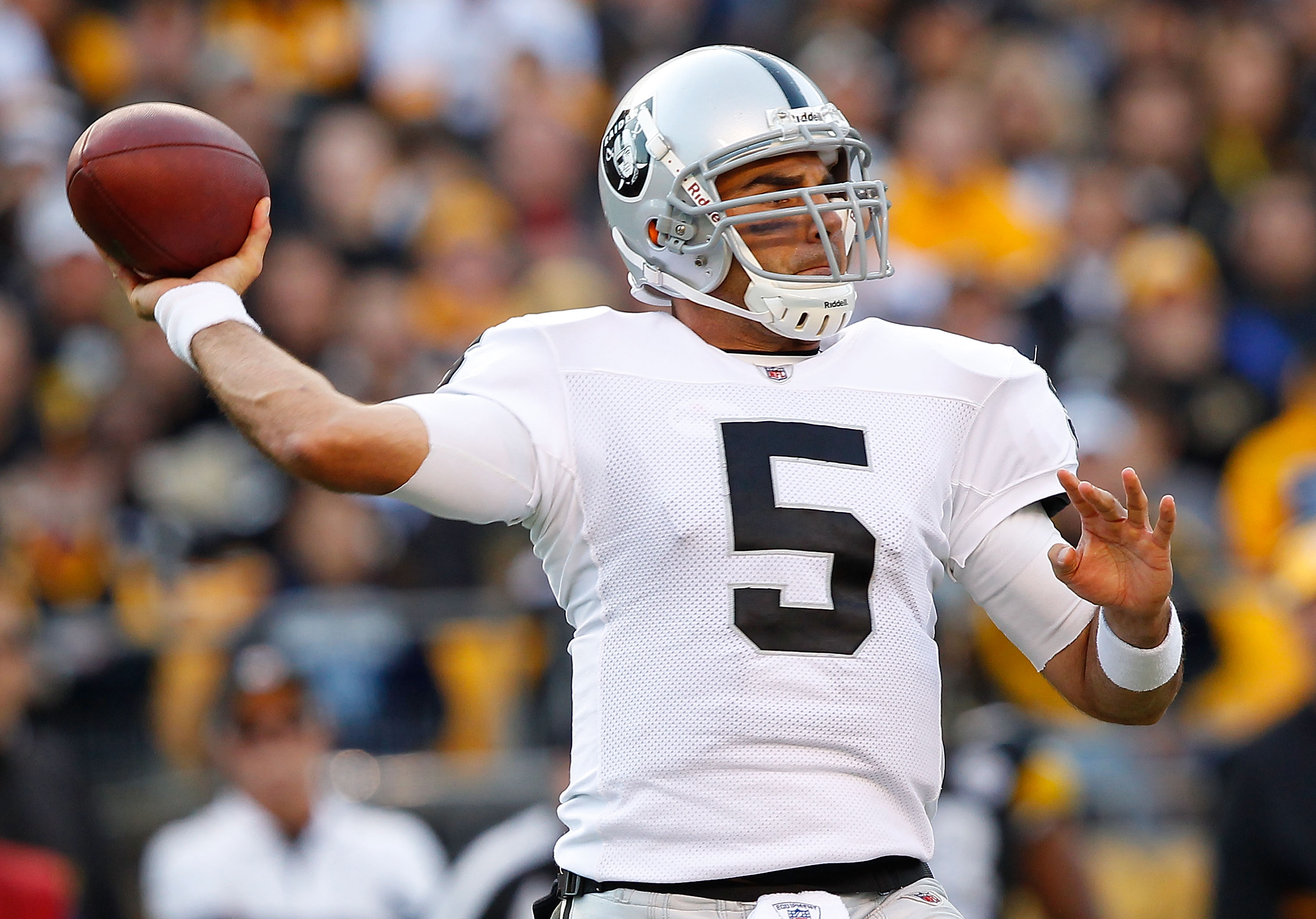 PITTSBURGH - NOVEMBER 21:  Bruce Gradkowski #5 of the Oakland Raiders drops back to pass during the game against the Pittsburgh Steelers on November 21, 2010 at Heinz Field in Pittsburgh, Pennsylvania.  (Photo by Jared Wickerham/Getty Images)