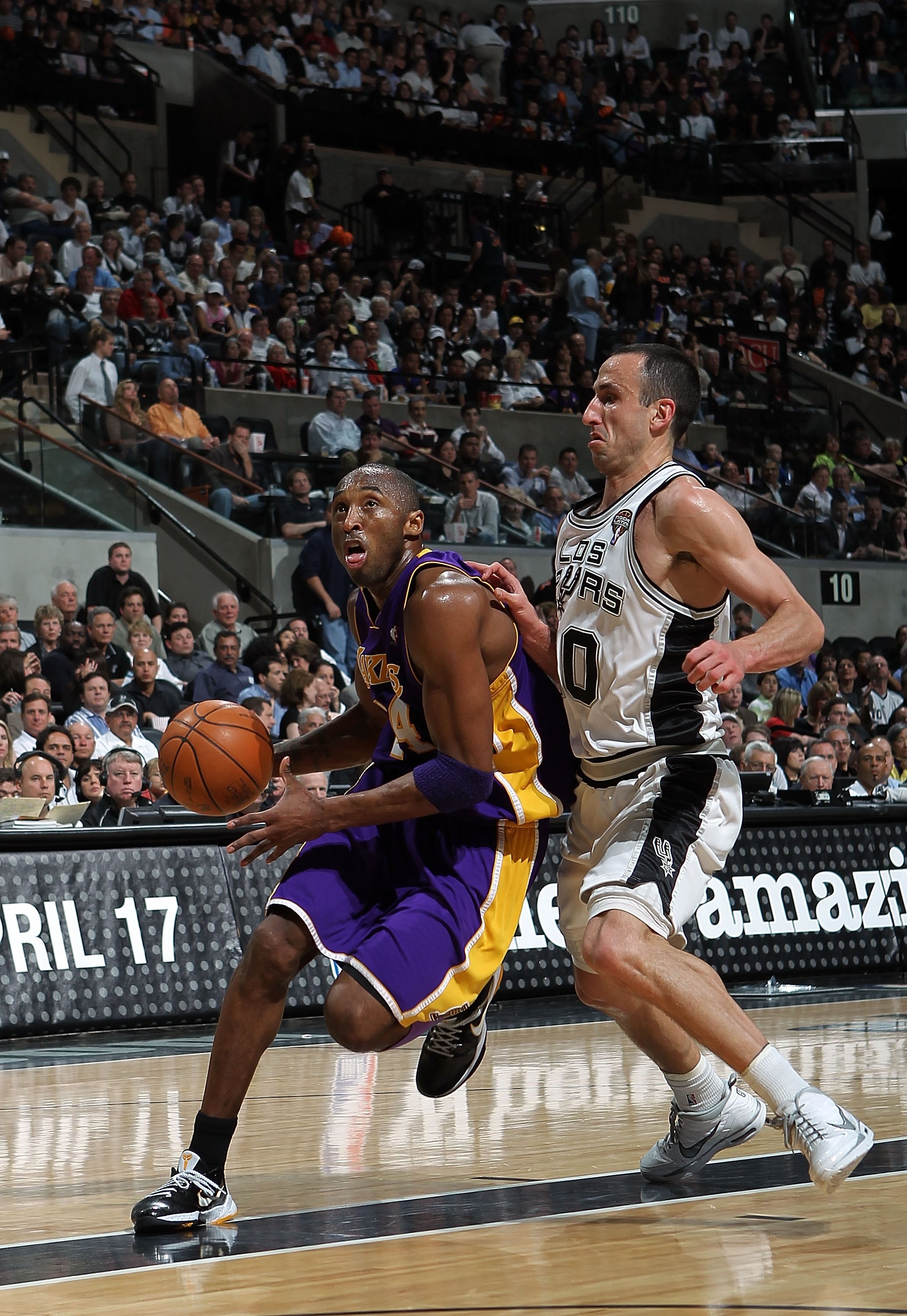 SAN ANTONIO - MARCH 24:  Guard Kobe Bryant #24 of the Los Angeles Lakers dribbles the ball past Manu Ginobili #20 of the San Antonio Spurs at AT&T Center on March 24, 2010 in San Antonio, Texas.  NOTE TO USER: User expressly acknowledges and agrees that,