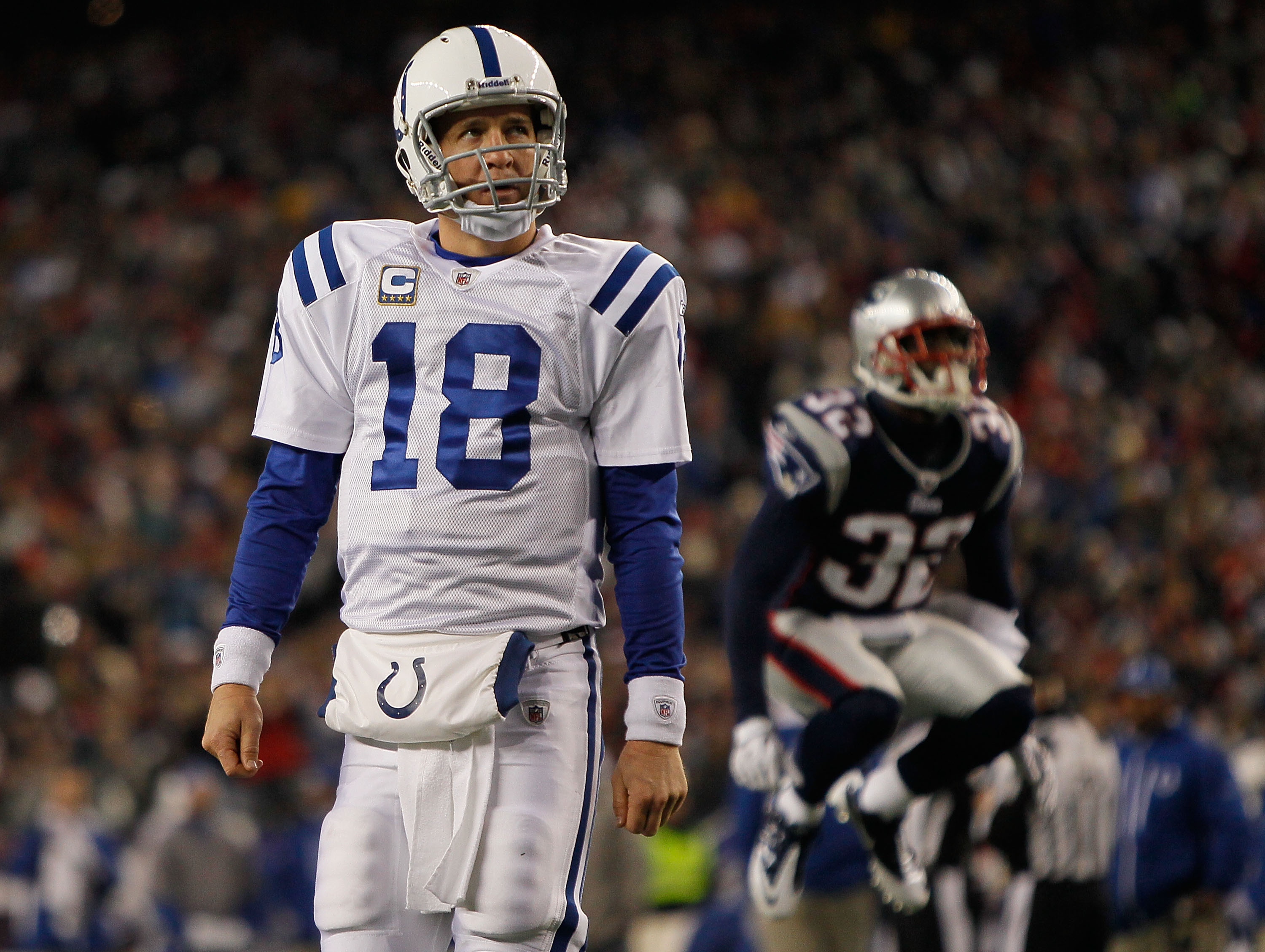FOXBORO, MA - NOVERMBER 21:  Peyton Manning #18 of the Indianapolis Colts looks at the clock as Devin McCourty #32 of the New England Patriots reacts in the second half at Gillette Stadium on November 21, 2010 in Foxboro, Massachusetts. (Photo by Jim Roga