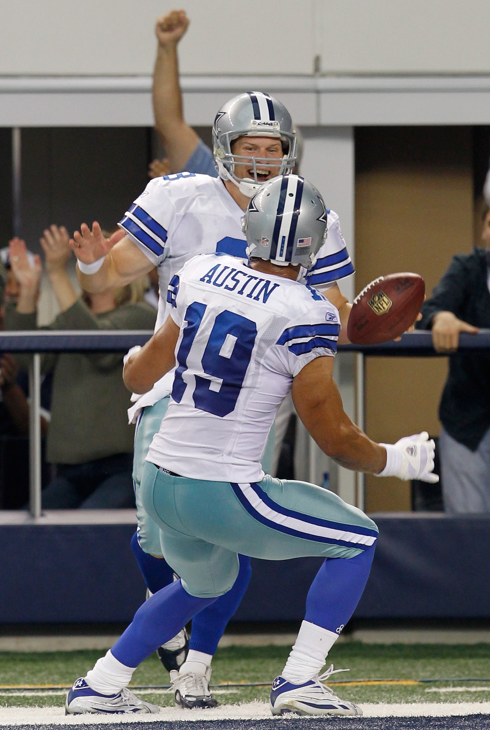 ARLINGTON, TX - NOVEMBER 21:  Wide receiver Miles Austin #19 of the Dallas Cowboys celebrates with quarterback Jon Kitna #3 after Kitna scored against the Detroit Lions late in the fourth quarter at Cowboys Stadium on November 21, 2010 in Arlington, Texas