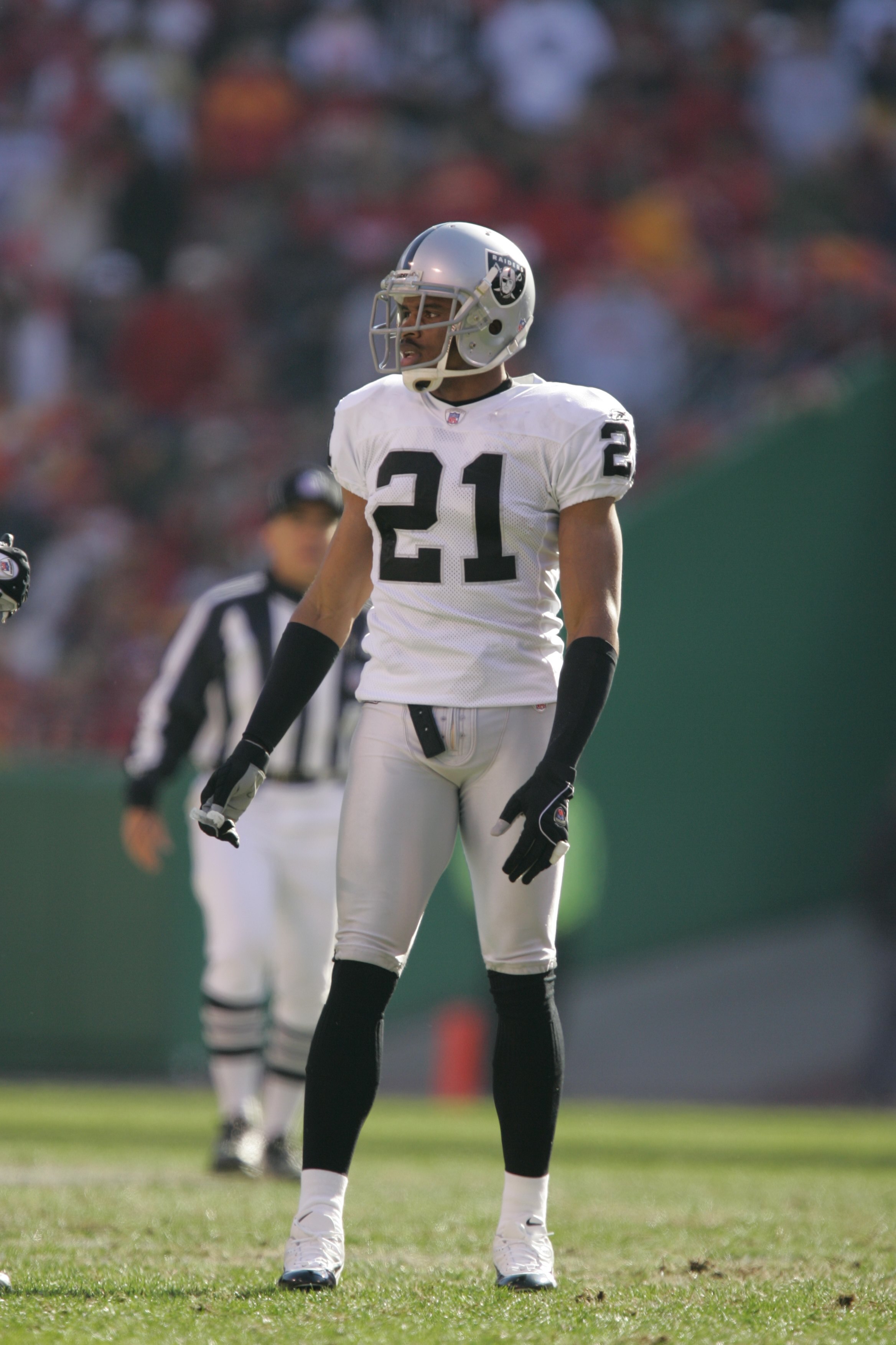 KANSAS CITY, MO - NOVEMBER 19:  Cornerback Nnamdi Asomugha #21 of the Oakland Raiders stands on the field against the Kansas City Chiefs on November 19, 2006 at Arrowhead Stadium in Kansas City, Missouri.  The Chiefs won 17-13.  (Photo by Brian Bahr/Getty