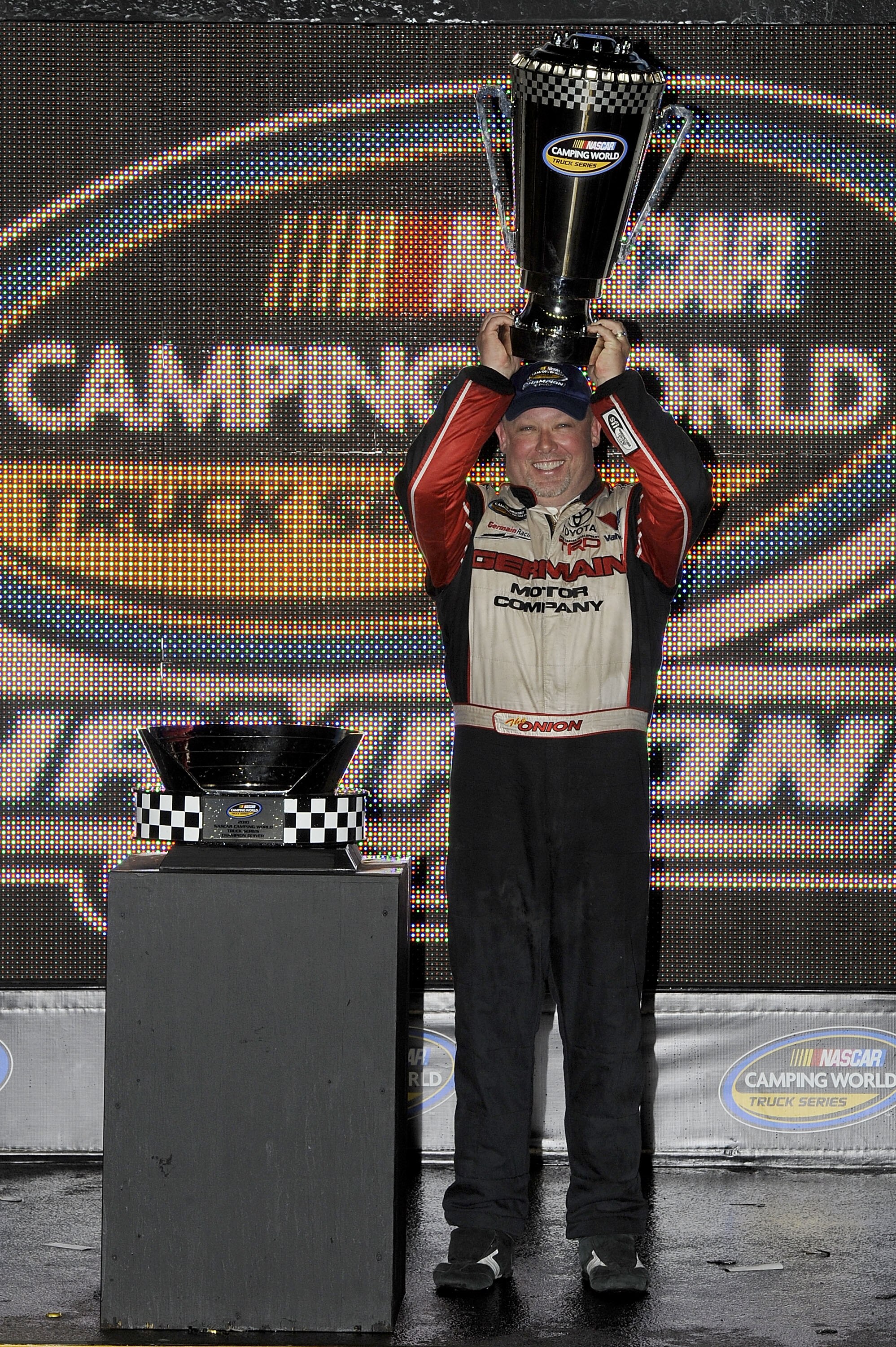 HOMESTEAD, FL - NOVEMBER 19:  Todd Bodine, driver of the #30 Germain Racing Toyota, celebrates winning the NASCAR Camping World Truck Series championship following the Ford 200 at Homestead-Miami Speedway on November 19, 2010 in Homestead, Florida.  (Phot