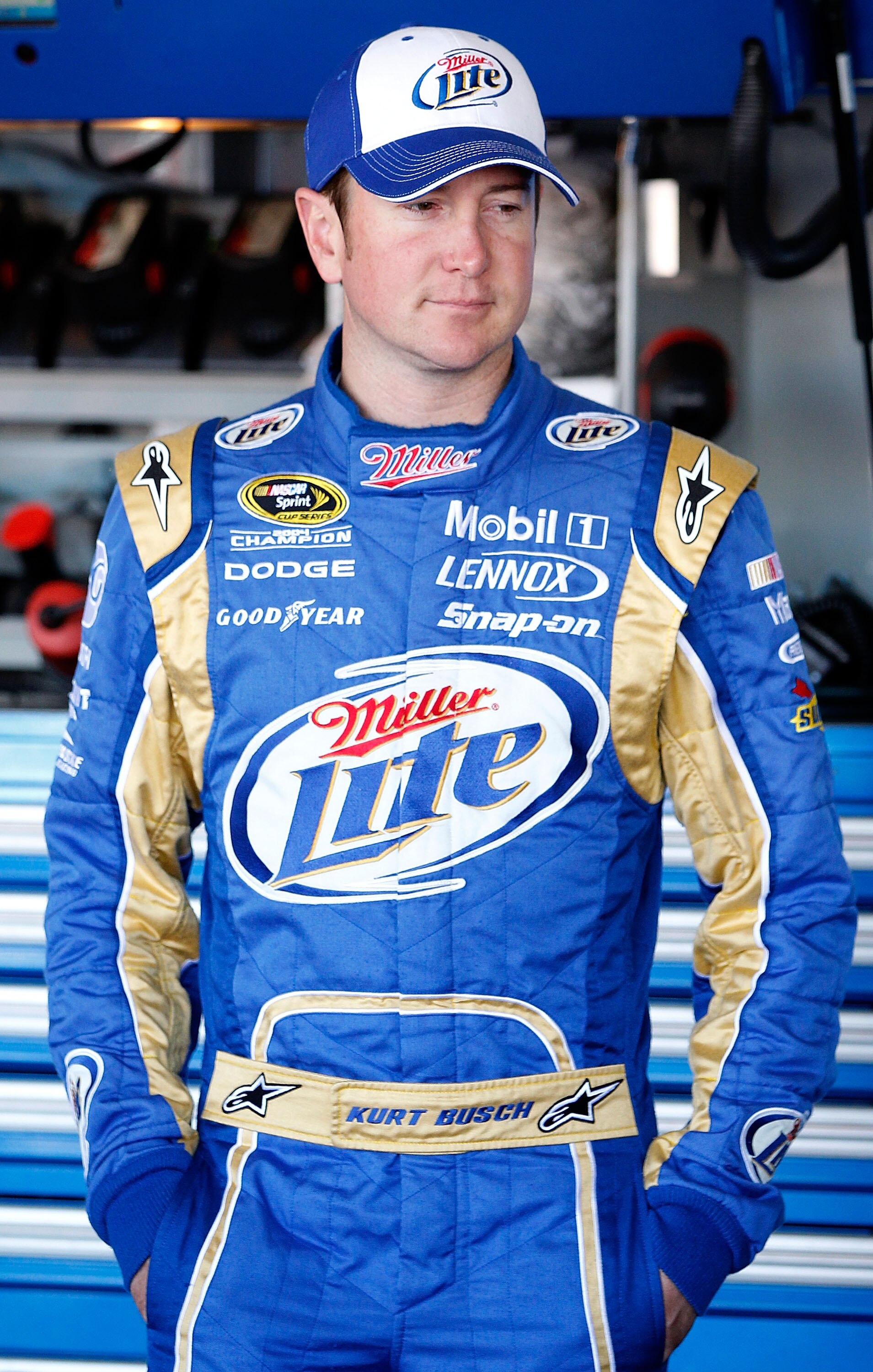 AVONDALE, AZ - NOVEMBER 12:  Kurt Busch, driver of the #2 Miller Lite Dodge, stands in the garage during practice for the NASCAR Sprint Cup Series Kobalt Tools 500 at Phoenix International Raceway on November 12, 2010 in Avondale, Arizona.  (Photo by Geof