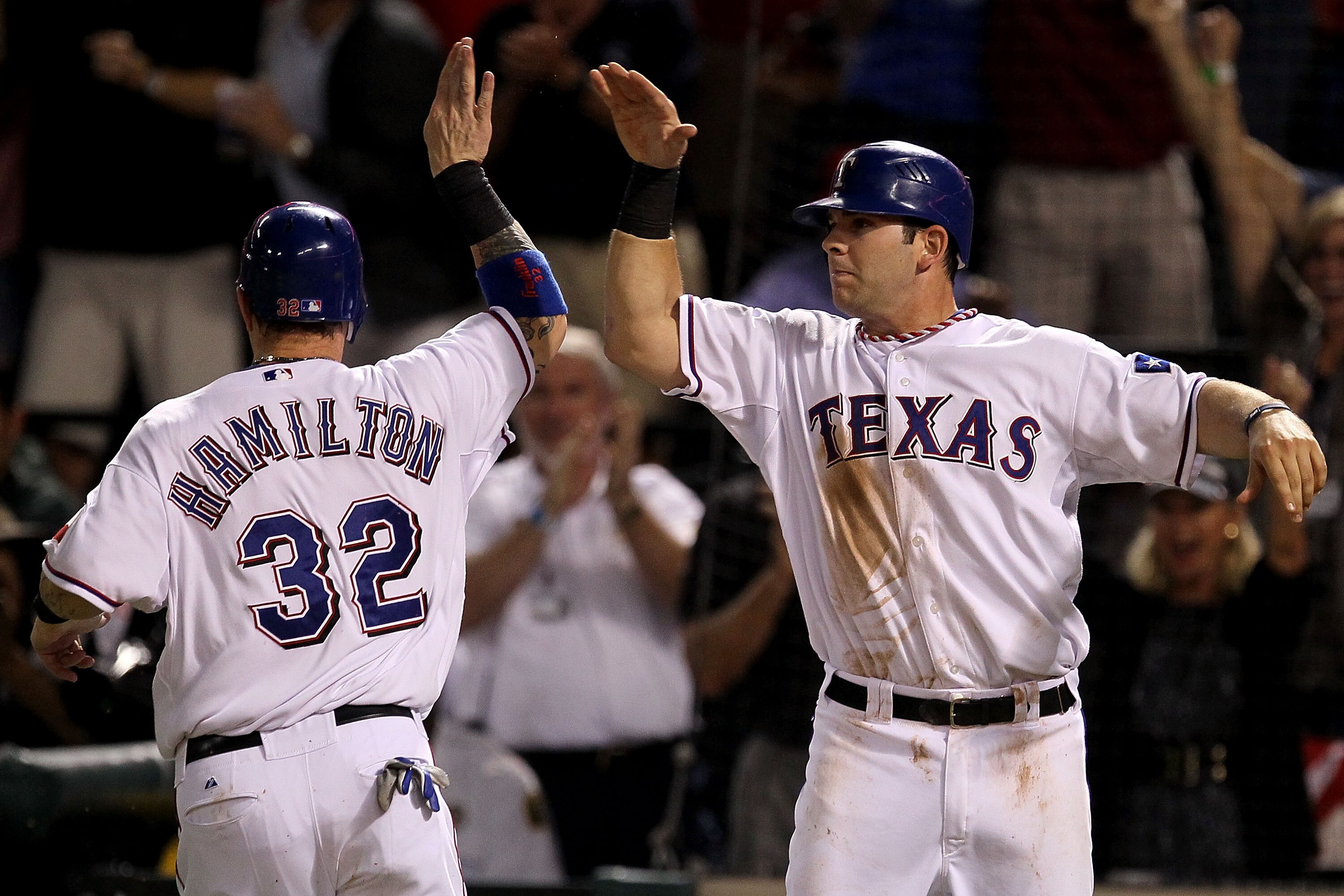 ARLINGTON, TX - OCTOBER 22:  Josh Hamilton #32 of the Texas Rangers celebrates with Mitch Moreland #18 after both scored on a double by Vladimir Guerrero #27 in the fifth inning of Game Six of the ALCS against the New York Yankees during the 2010 MLB Play