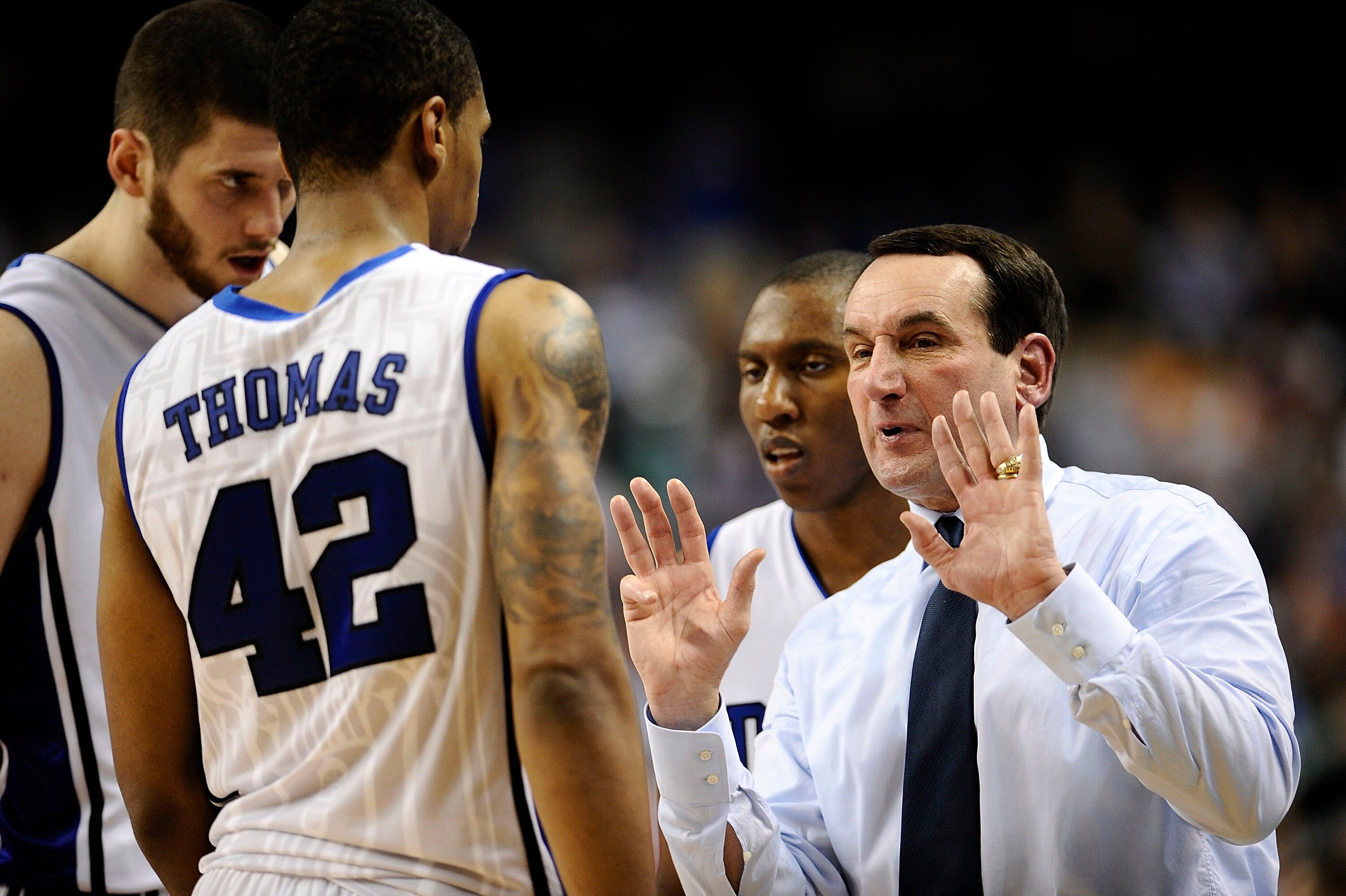 GREENSBORO, NC - MARCH 13:  Mike Krzyzewski, head coach of the Duke Blue Devils talks to his team against the University of Miami Hurricanes in their semifinal game in the 2010 ACC Men's Basketball Tournament at the Greensboro Coliseum on on March 13, 201