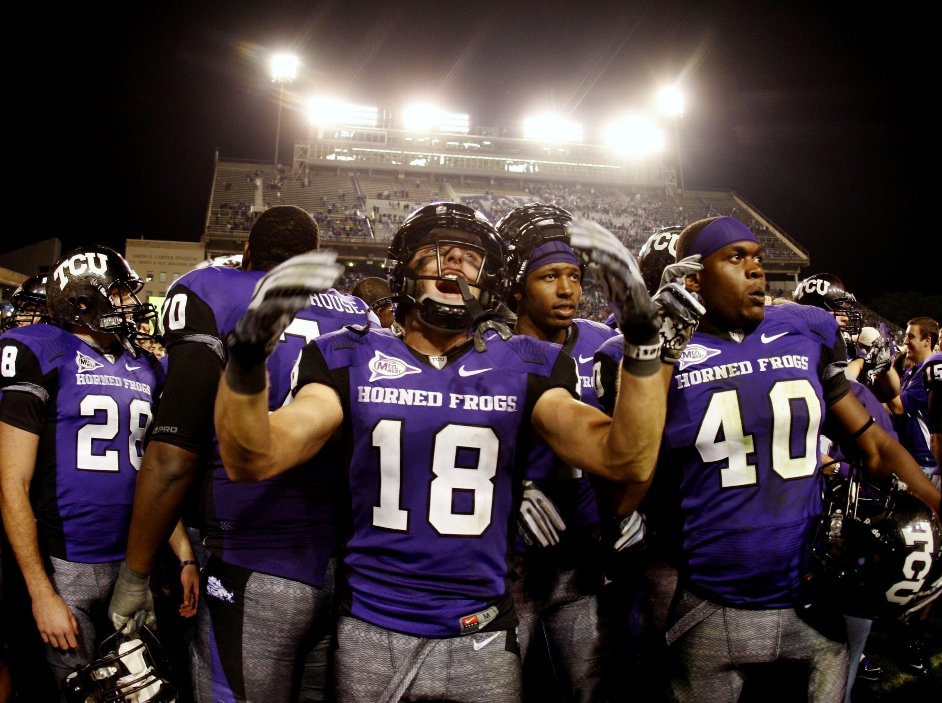 FORT WORTH, TX - NOVEMBER 14: Ryan Christian #18 of the TCU Horned Frogs celebrates his teams 55-28 victory over the Utah Utes at Amon G. Carter Stadium on November 14, 2009 in Fort Worth, Texas. (Photo by Ronald Martinez/Getty Images)