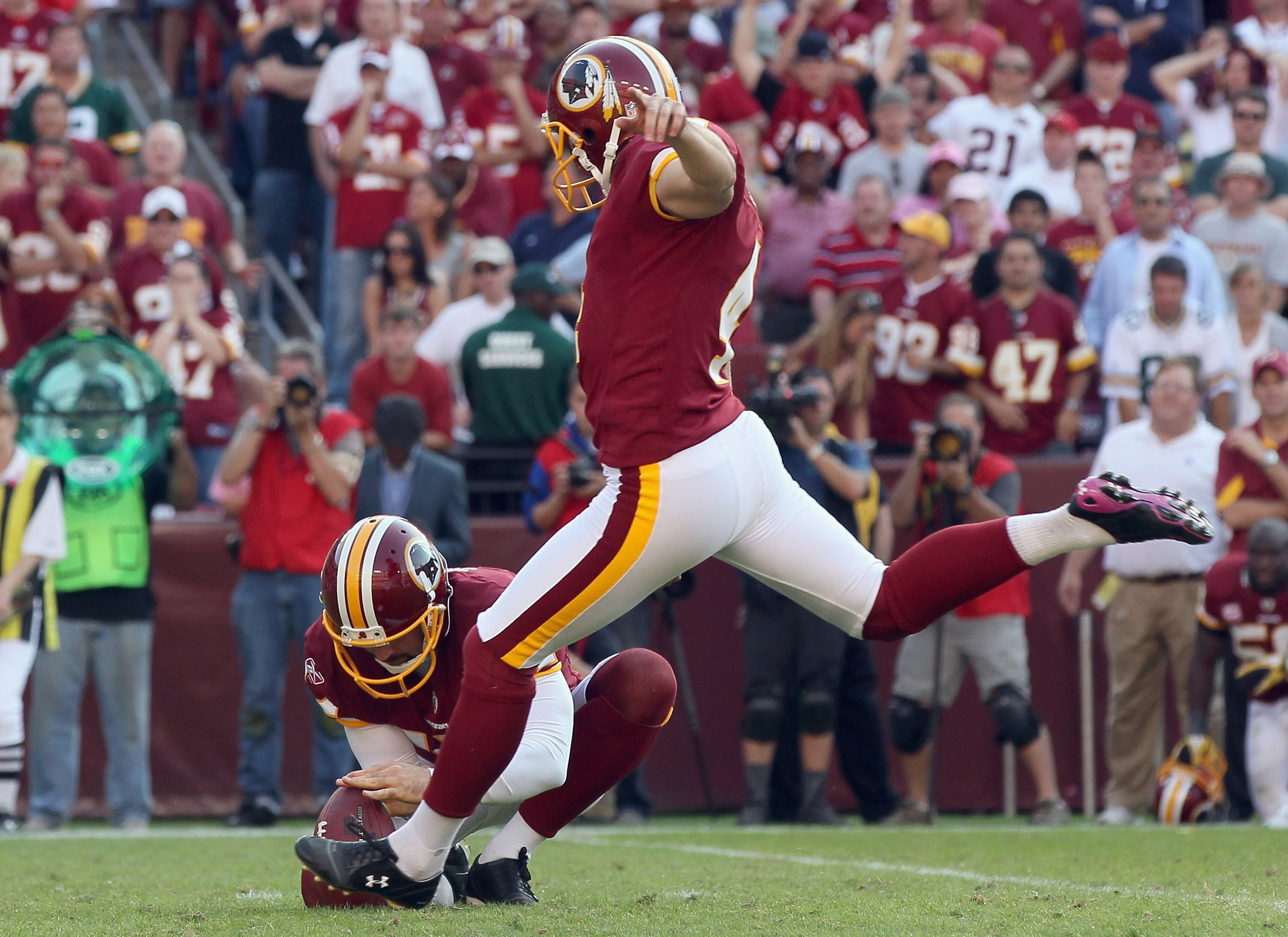 LANDOVER, MD - OCTOBER 10:  Washington Redskins kicker Graham Gano #4 kicks the game winning field goal in overtime against the Green Bay Packers at FedExField on October 10, 2010 in Landover, Maryland. The Redskins won the game 16-13.  (Photo by Win McNa