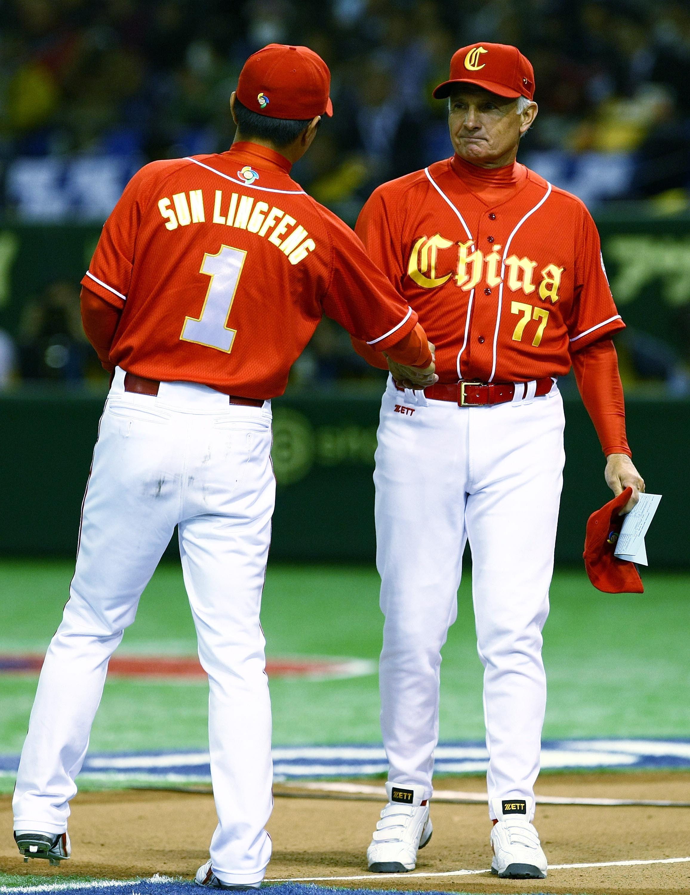TOKYO - MARCH 05:  Team Manager Terry Collins of China shakes hands with Outfielder Sun Lingfeng #1 of China during the World Baseball Classic Tokyo Round match between Japan and China at Tokyo Dome on March 5, 2009 in Tokyo, Japan.  (Photo by Junko Kimur