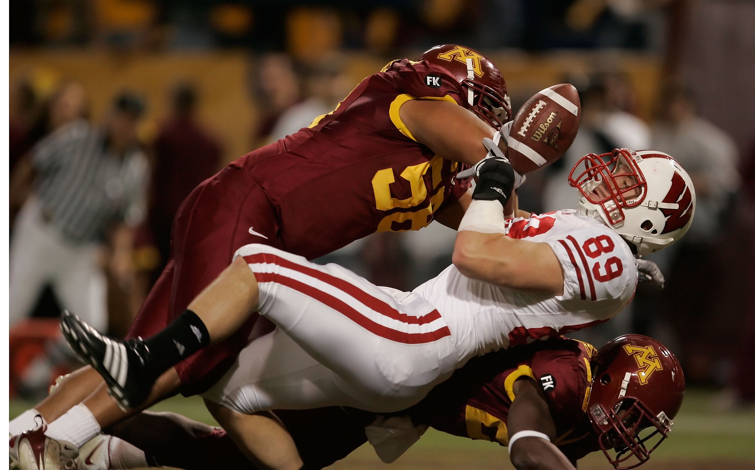 MINNEAPOLIS - NOVEMBER 17:  Mike Sherels (L) #58 of the Minnesota Golden Gophers breaks up a pass intended for Garrett Graham #89 of the Wisconsin Badgers in the first quarter at the Hubert H. Humphrey Metrodome November 17, 2007 in Minneapolis, Minnesota