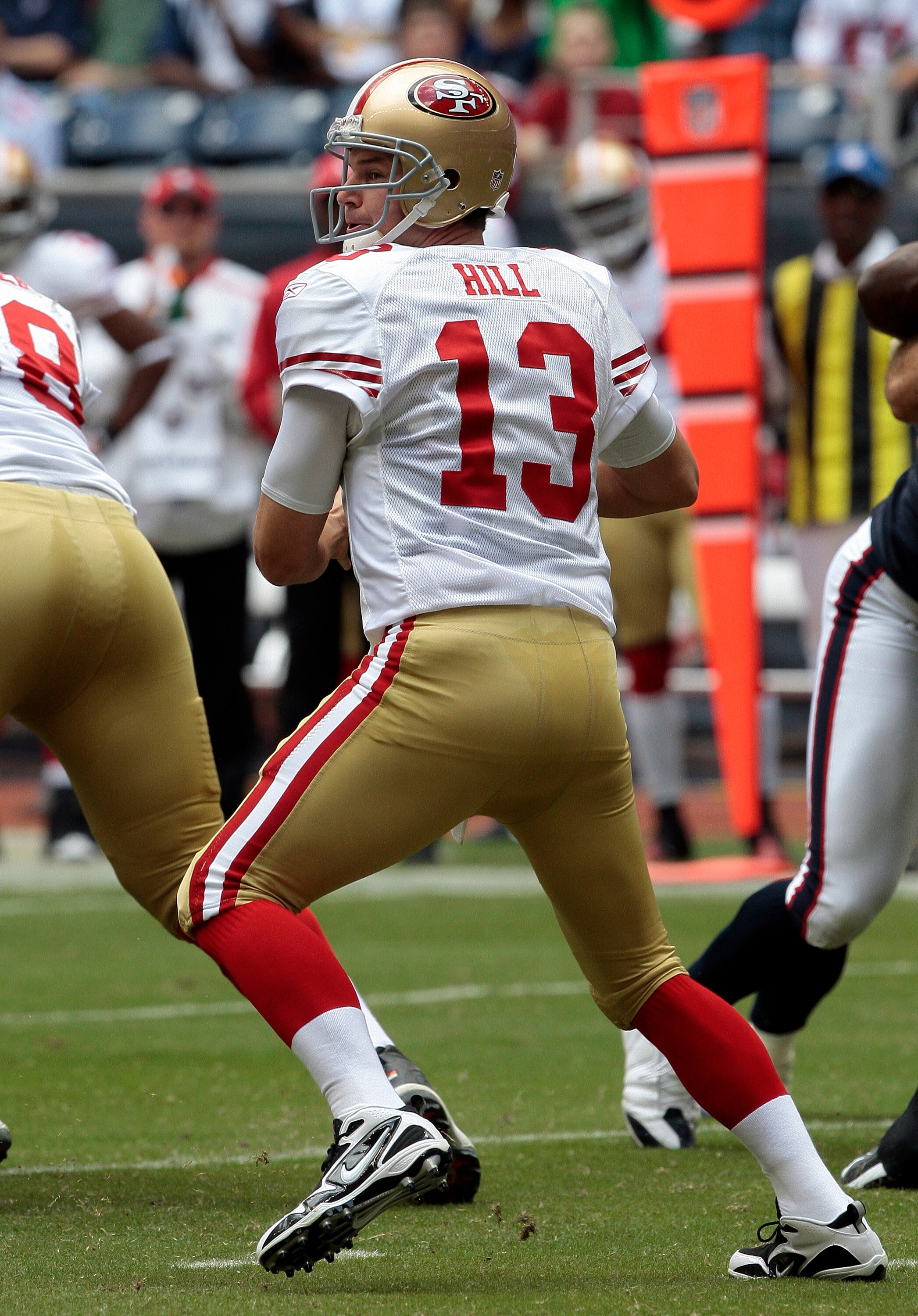 HOUSTON - OCTOBER 25:  Quarterback Shaun Hill #13 of the San Francisco 49ers looks for a receiver against the Houston Texans at Reliant Stadium on October 25, 2009 in Houston, Texas.  (Photo by Bob Levey/Getty Images)
